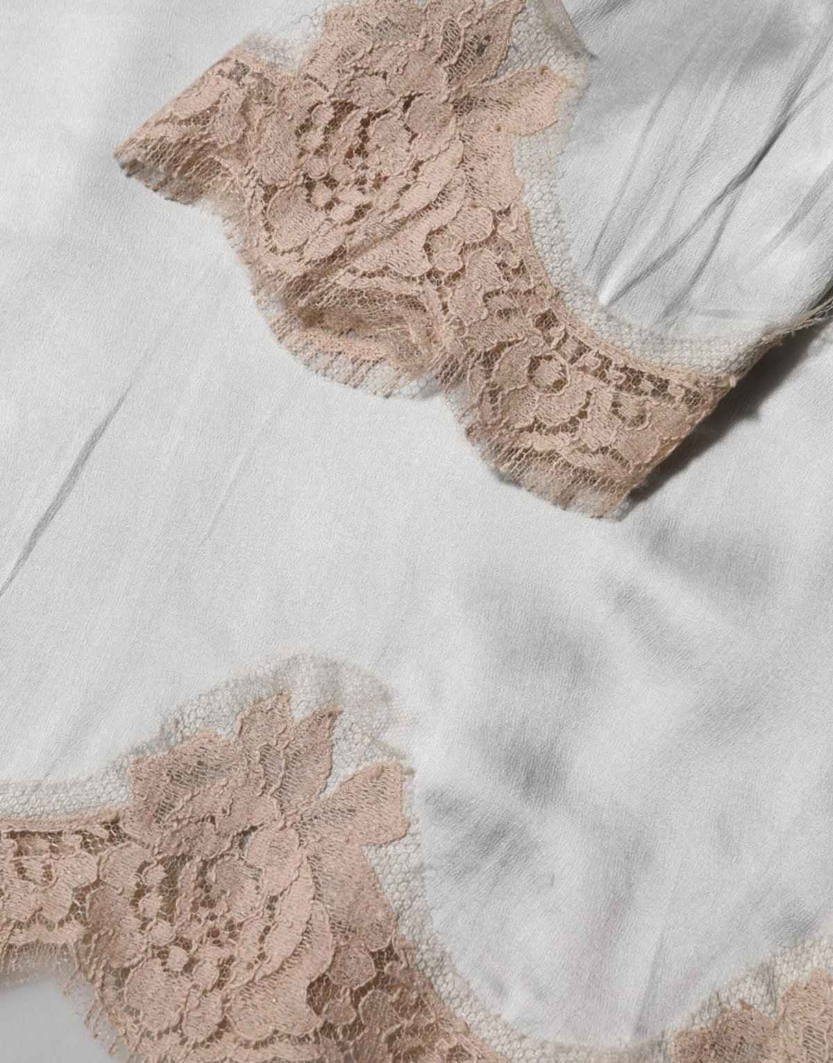 Indulge in the exquisite allure of Dolce & Gabbana's Gray Silk Satin Floral Lace Long Sleeve Top, a masterpiece of Italian craftsmanship that elevates your elegance.