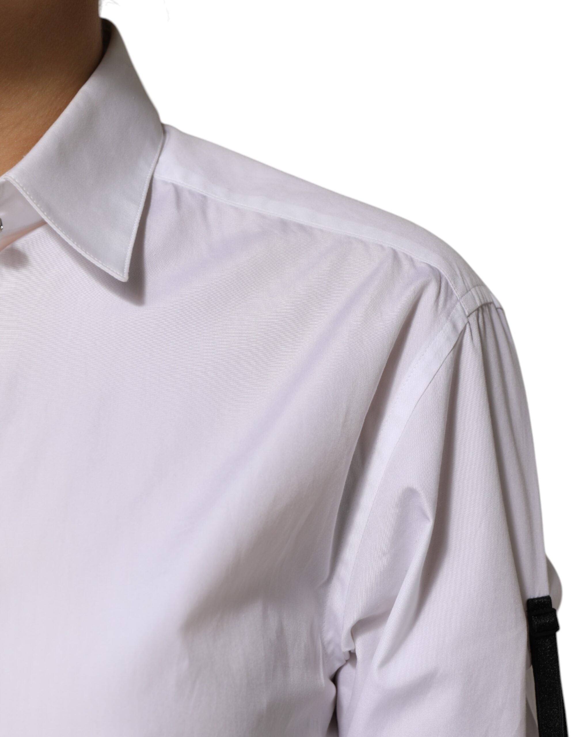 Indulge in the exquisite allure of the Dolce & Gabbana White Crystal Embellished Dress Shirt, where luxurious cotton meets captivating crystal details, embodying timeless elegance for the discerning connoisseur.