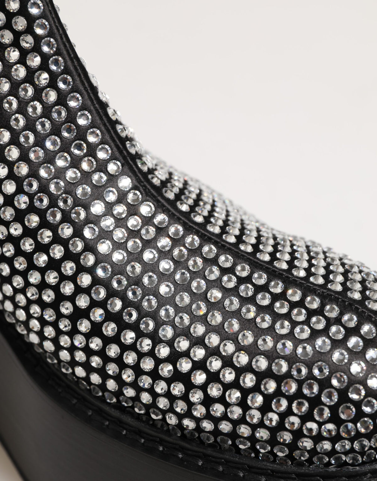 Indulge in the exquisite craftsmanship of Dolce & Gabbana's Black Crystal Strass Mid Calf Short Boots, where luxurious materials and timeless elegance elevate every occasion.