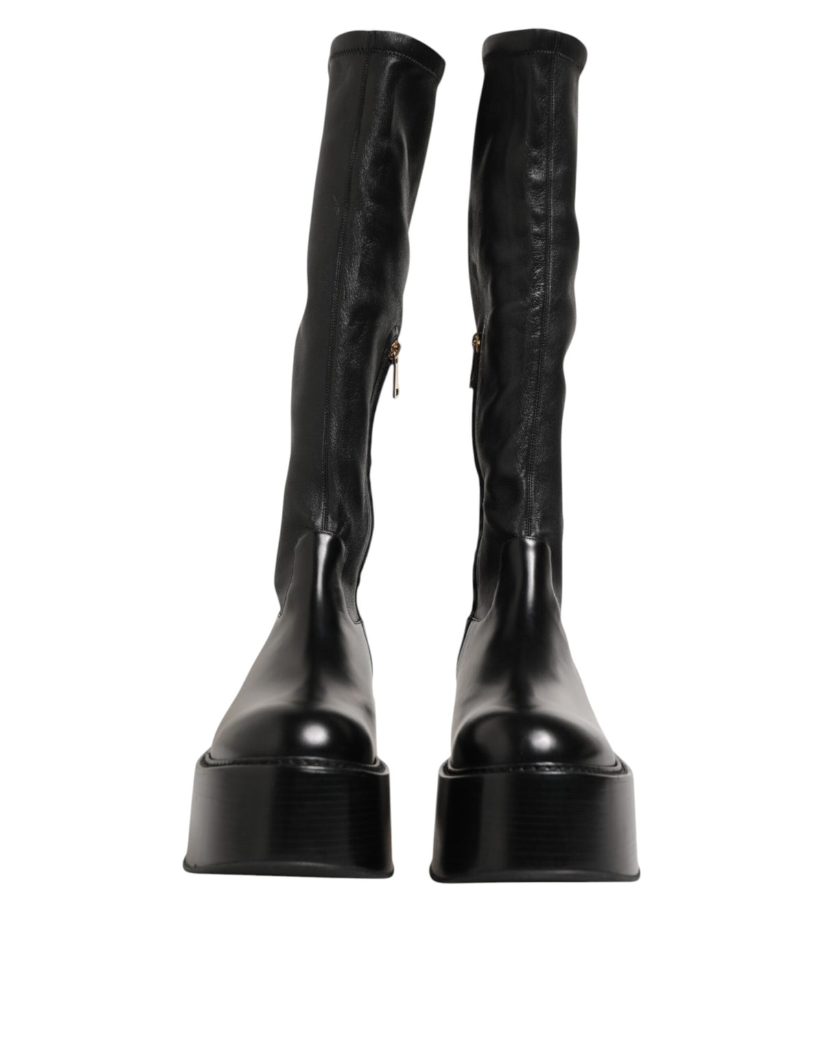 Indulge in the exquisite craftsmanship of Dolce & Gabbana's Black Logo Plaque Over The Calf Boots, where luxurious materials meet timeless elegance for the discerning individual.