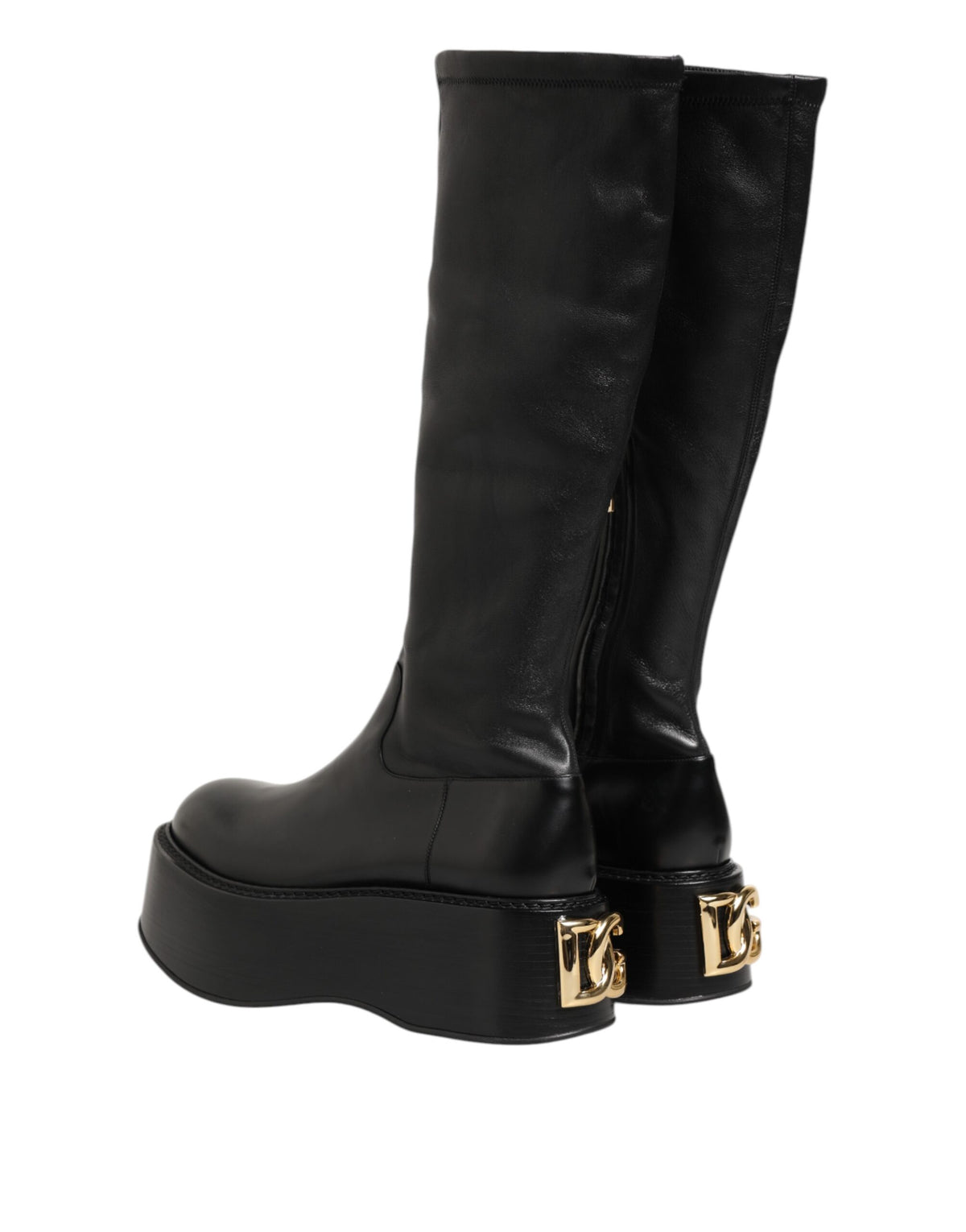 Indulge in the exquisite Dolce & Gabbana Black Logo Plaque Over The Calf Boots, where luxurious materials and Italian craftsmanship elevate your style to unparalleled heights.
