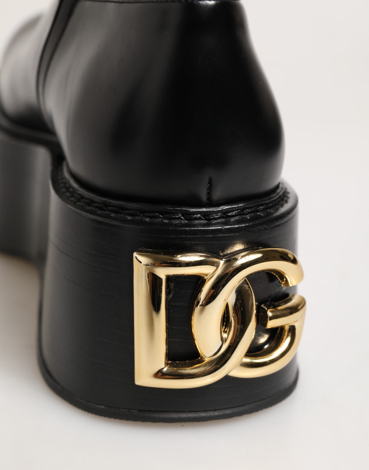 Elevate your style with Dolce & Gabbana's Black Logo Plaque Over The Calf Boots, where exquisite craftsmanship and luxurious materials create a statement of timeless elegance.