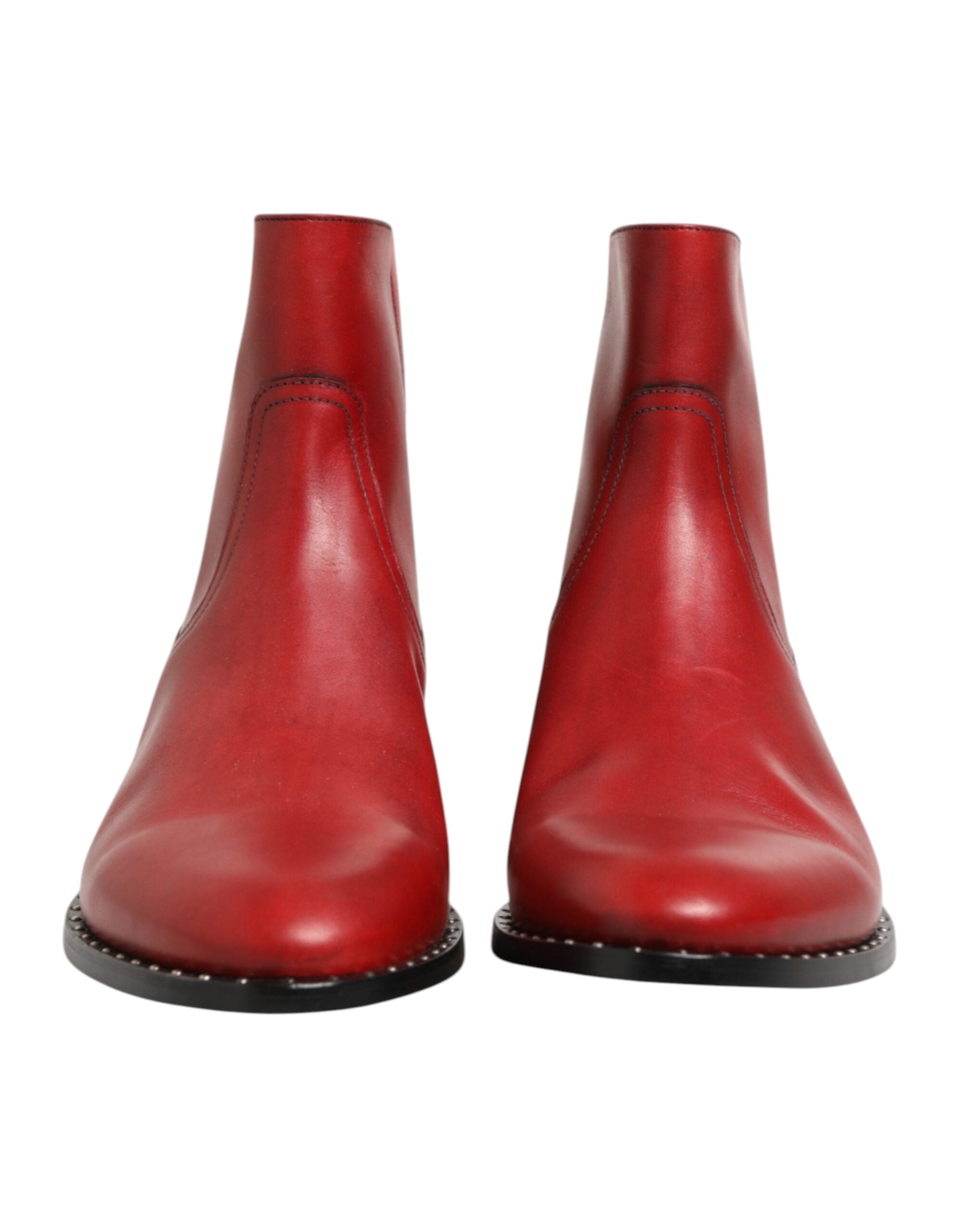Indulge in the exquisite Dolce & Gabbana Red Studded Chelsea Ankle Boots, crafted from luxurious calf leather, embodying bold elegance and unmatched Italian craftsmanship.