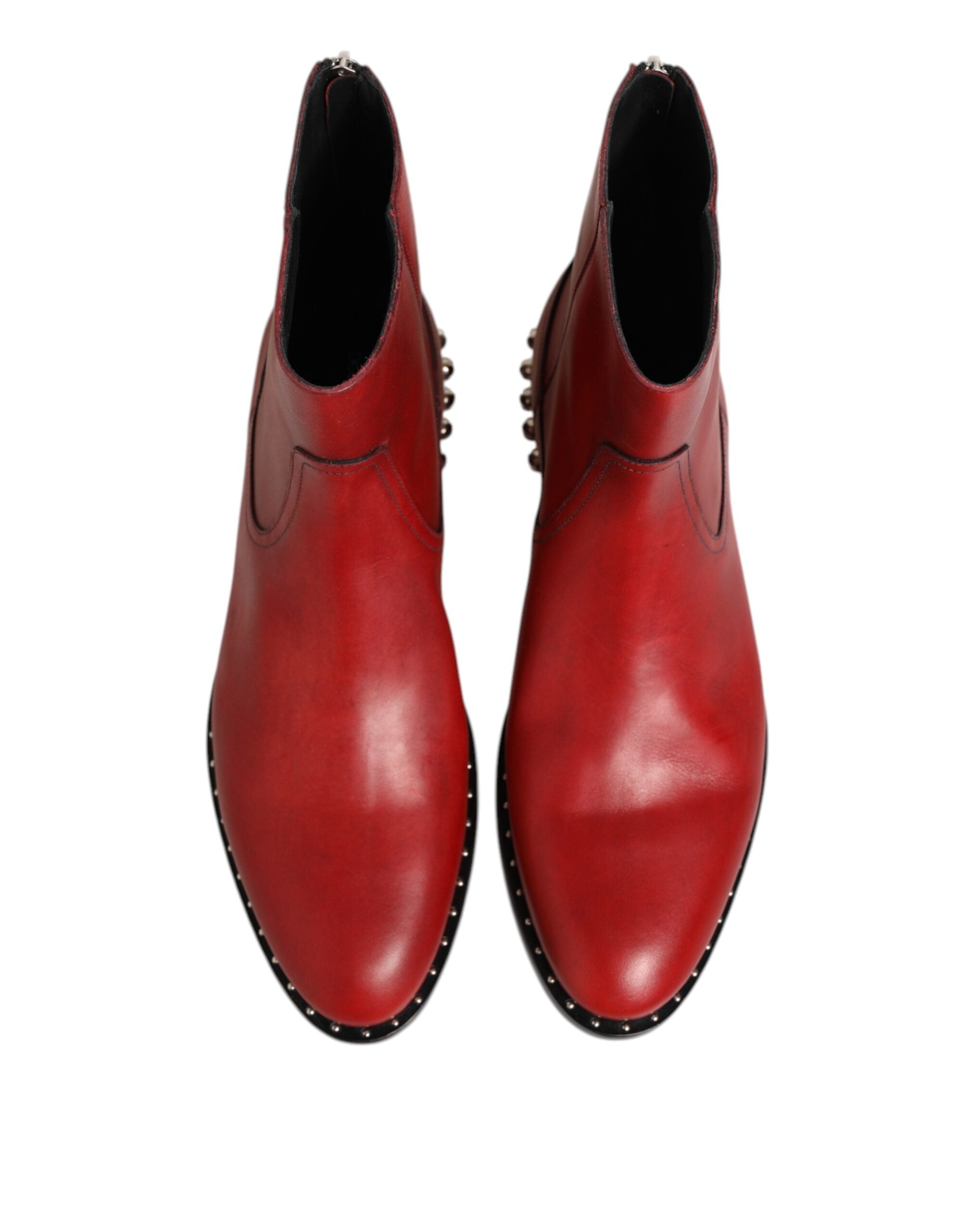 Indulge in the exquisite Dolce & Gabbana Red Studded Chelsea Ankle Boots, crafted from luxurious calf leather, a bold statement of elegance and sophistication for the discerning individual.