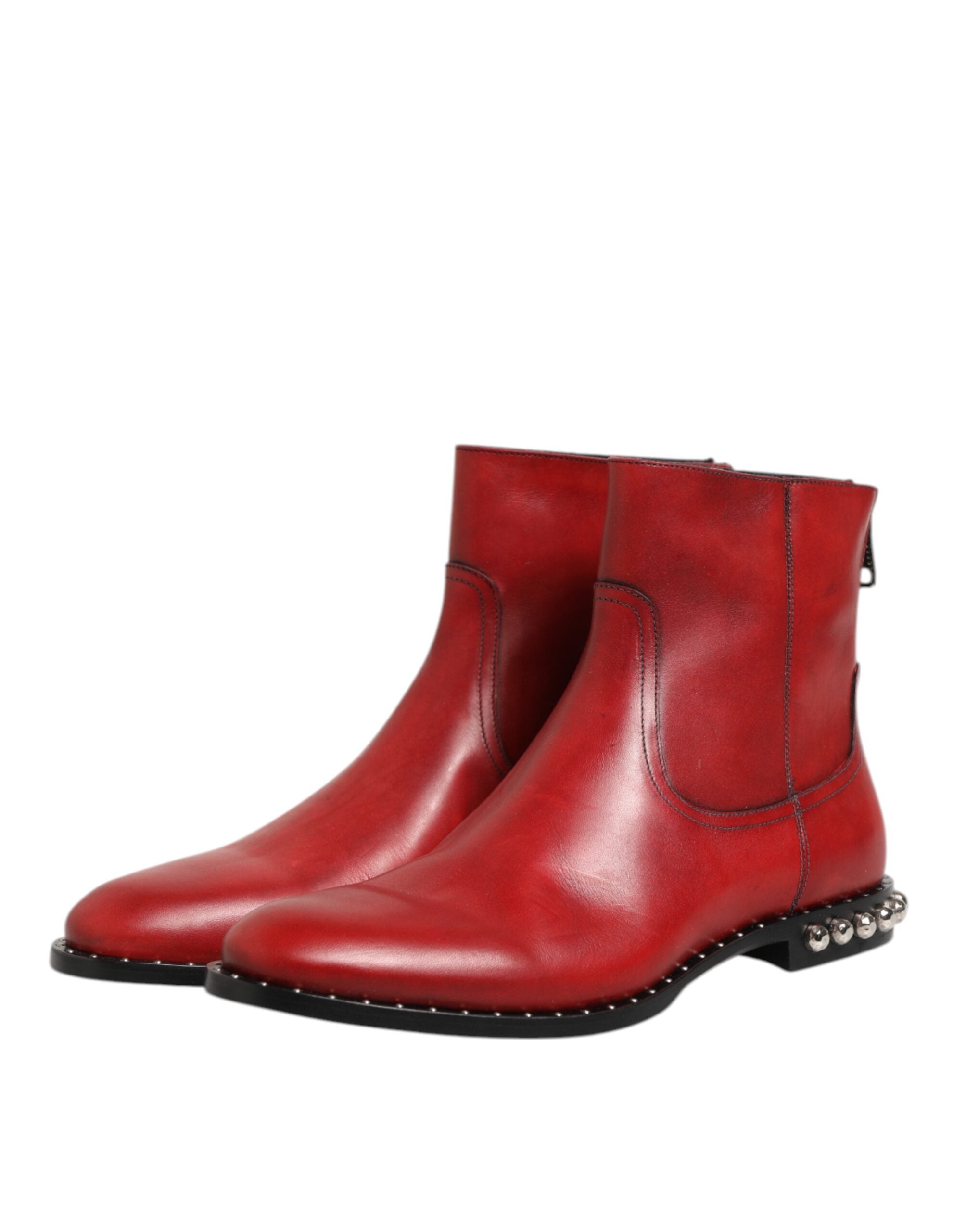 Indulge in the exquisite Dolce & Gabbana Red Studded Chelsea Ankle Boots, crafted from premium calf leather, a bold statement of elegance and sophistication for the discerning individual.