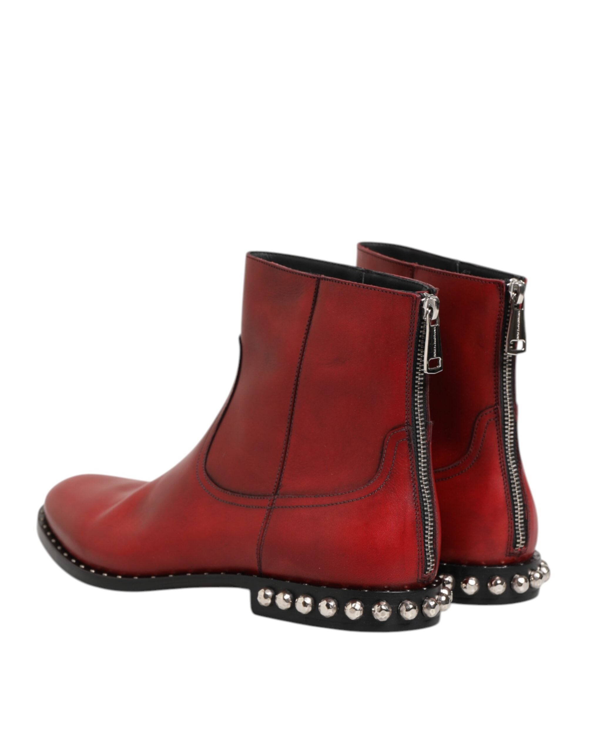 Indulge in the exquisite Dolce & Gabbana Red Studded Chelsea Ankle Boots, crafted from premium calf leather for an effortless blend of elegance and bold sophistication.