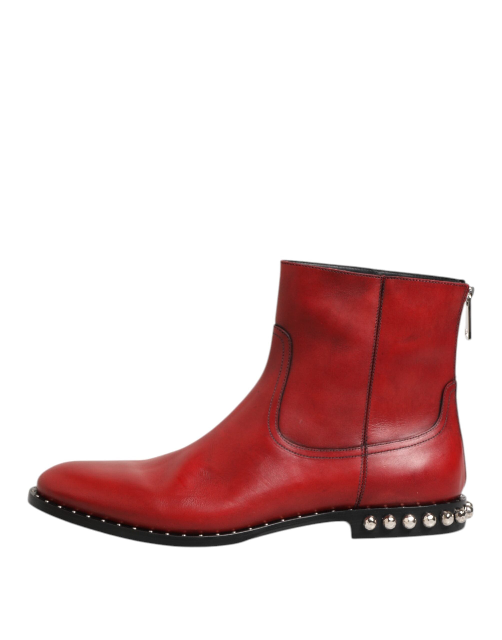 Indulge in the exquisite Dolce & Gabbana Red Studded Chelsea Ankle Boots, crafted from luxurious calf leather, embodying bold elegance and timeless sophistication.