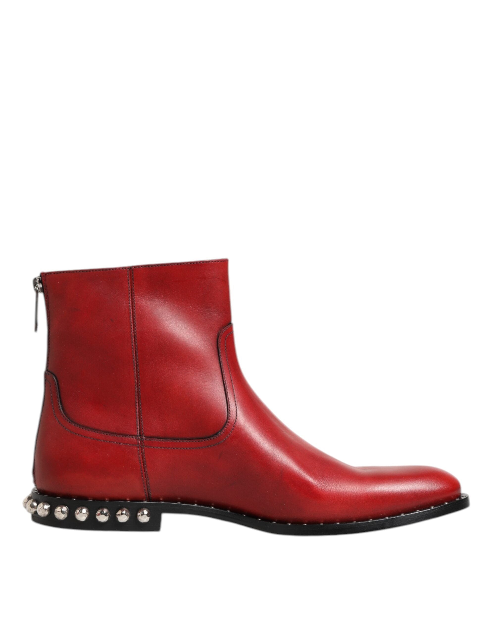 Indulge in the exquisite Dolce & Gabbana Red Studded Chelsea Ankle Boots, crafted from luxurious calf leather, embodying bold elegance and Italian craftsmanship for the discerning individual.
