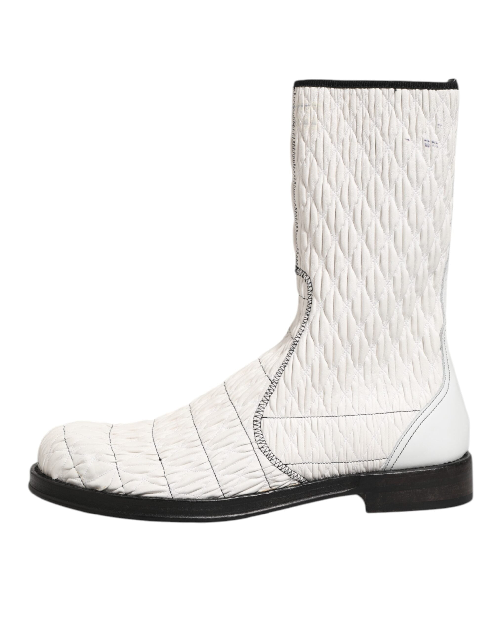 Elevate your style with Dolce & Gabbana's White Lambskin Leather Mid Calf Boots, where exquisite craftsmanship meets timeless elegance for the discerning individual.