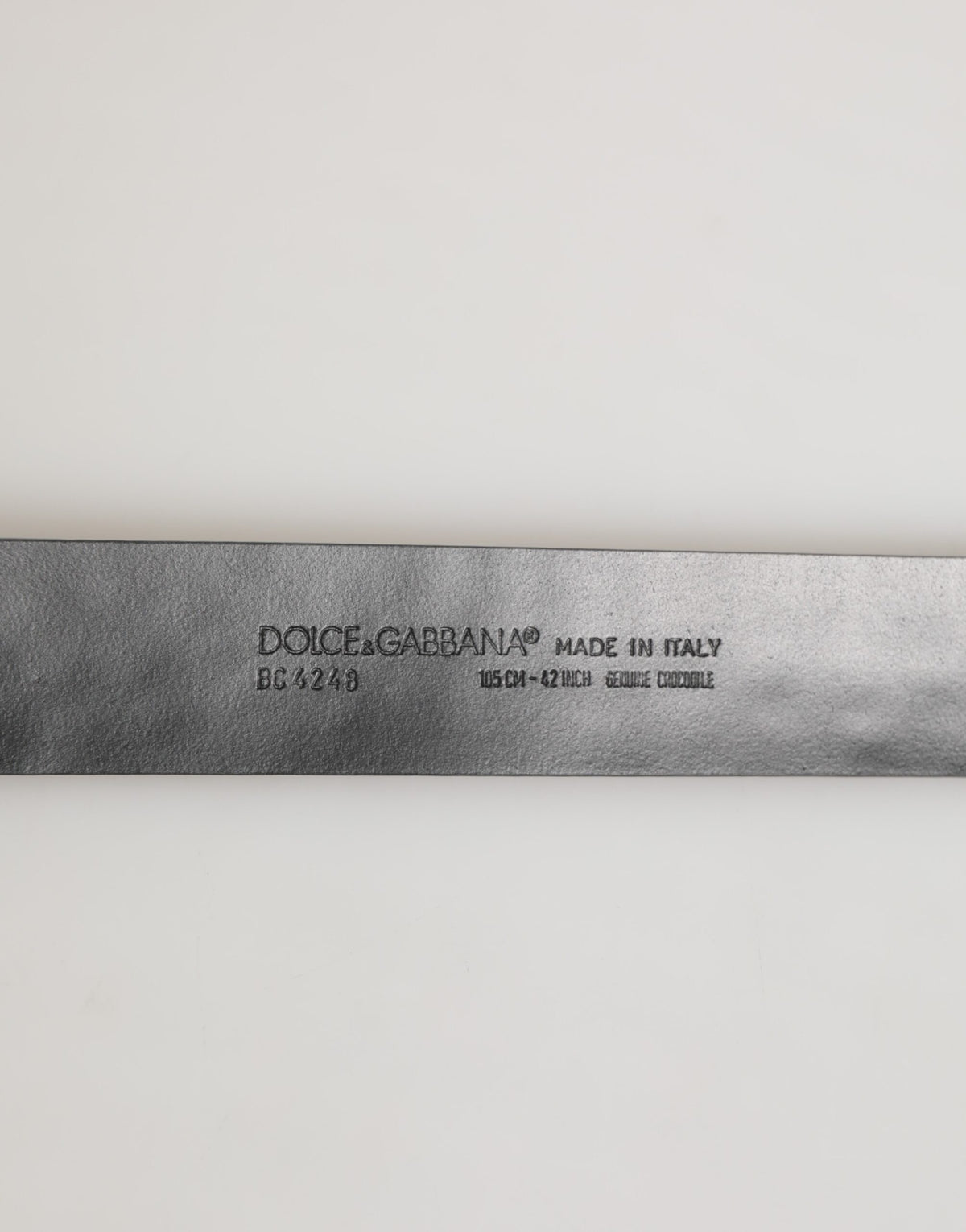 Indulge in the exquisite Dolce & Gabbana Black Exotic Leather DG Logo Buckle Belt, a symbol of luxury and sophistication, crafted from sumptuous Caiman Leather for timeless elegance.