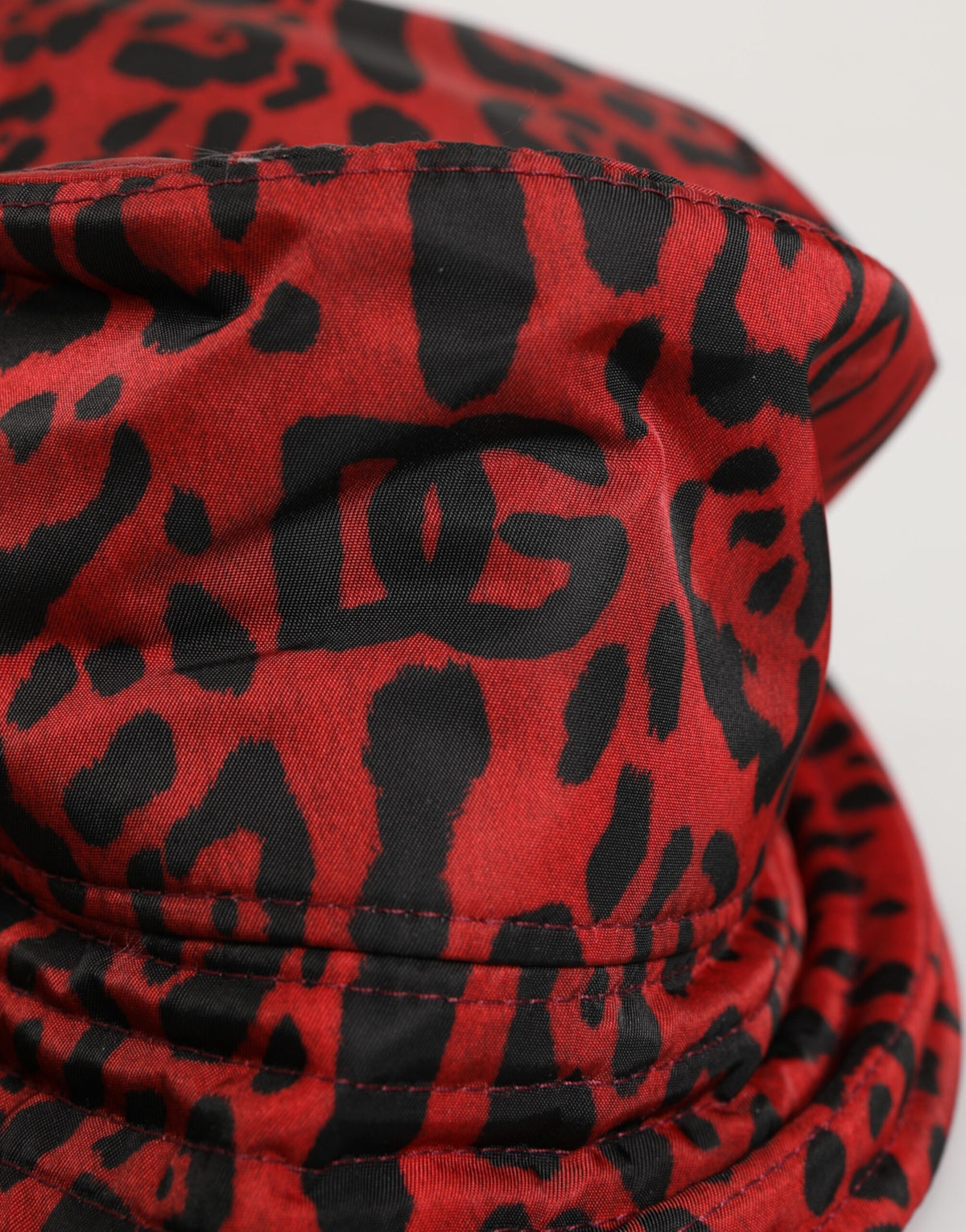 Elevate your style with the Dolce & Gabbana Red Black Nylon Leopard Print Bucket Hat, a luxurious blend of artistry and sophistication, crafted in Italy for the discerning connoisseur.