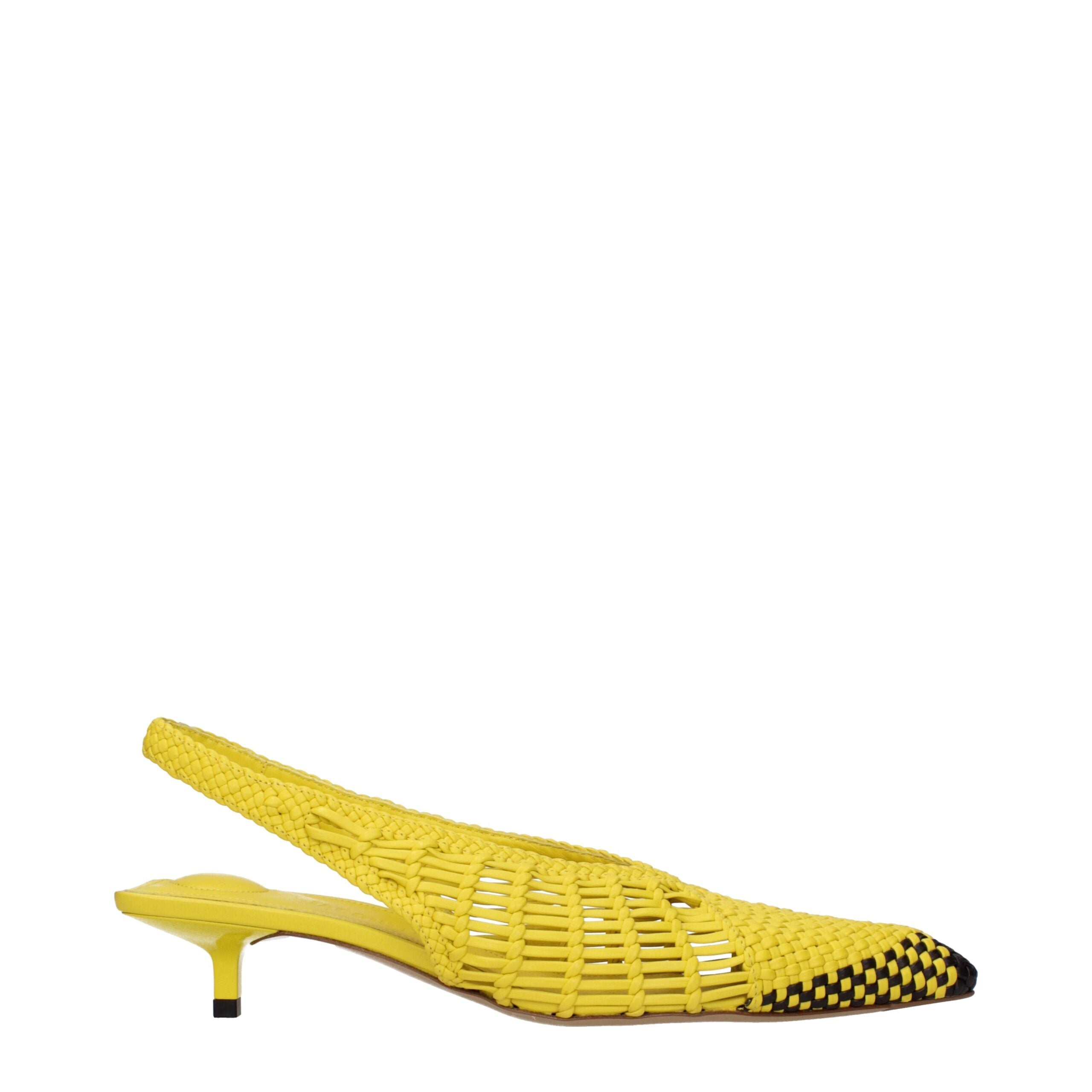 Indulge in the exquisite Jacquemus Yellow Leather Flat Sandals, where premium craftsmanship meets timeless elegance, perfect for the discerning individual seeking luxury.