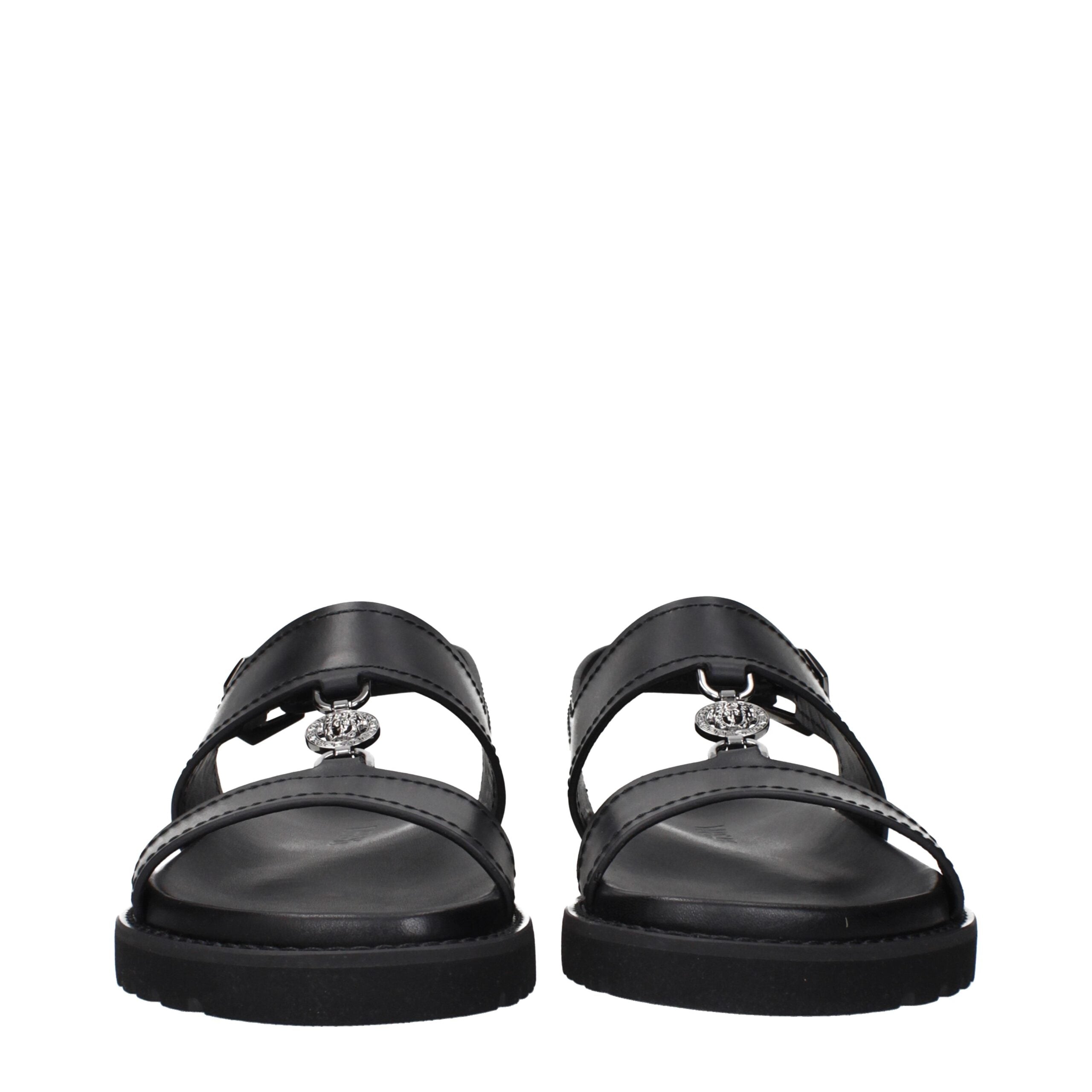 Experience the allure of Versace Black Leather Flat Sandals, where premium craftsmanship meets timeless elegance, perfect for the discerning individual seeking luxurious sophistication.