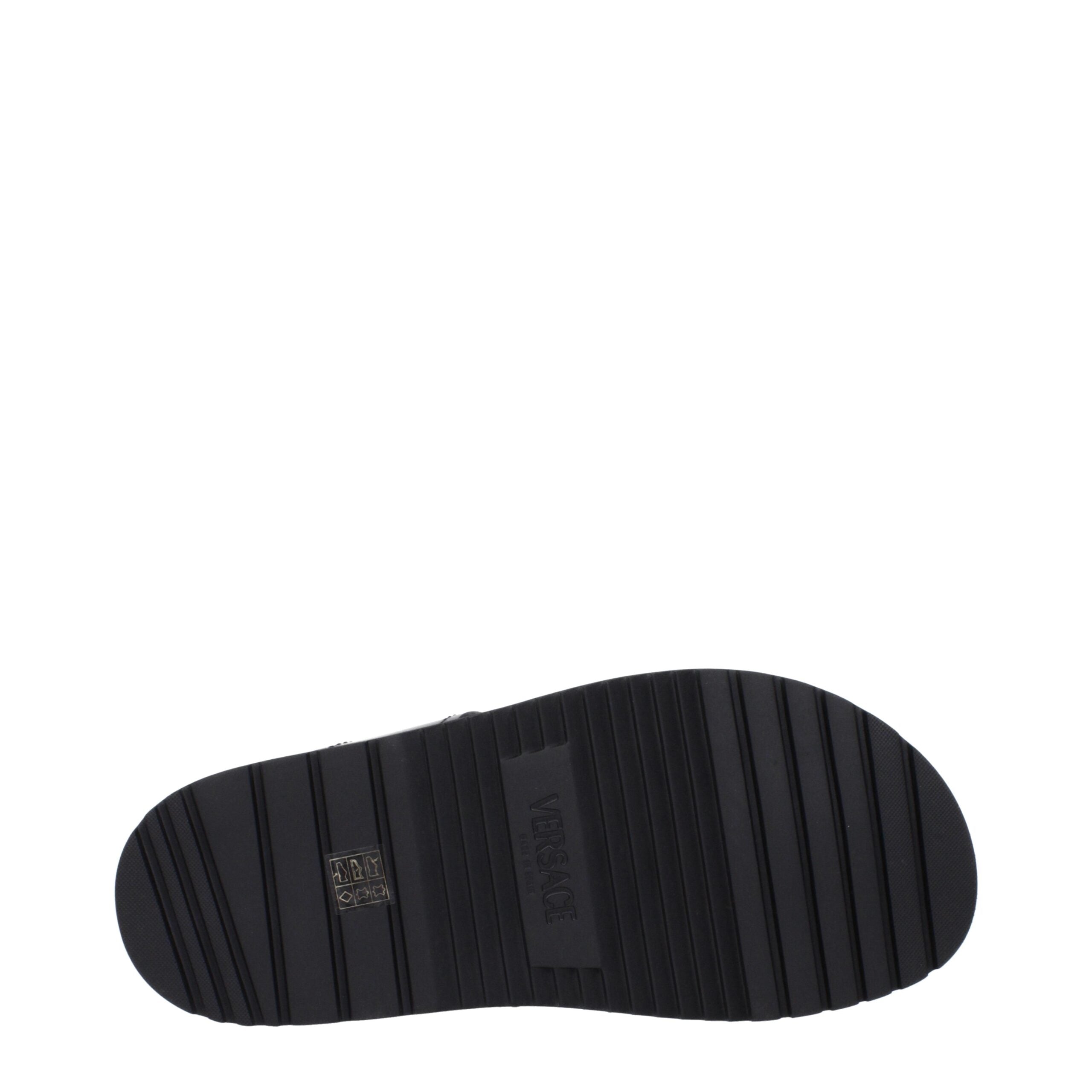 Step into elegance with Versace Black Leather Flat Sandals, where premium craftsmanship meets timeless design, perfect for the discerning individual seeking luxurious sophistication.