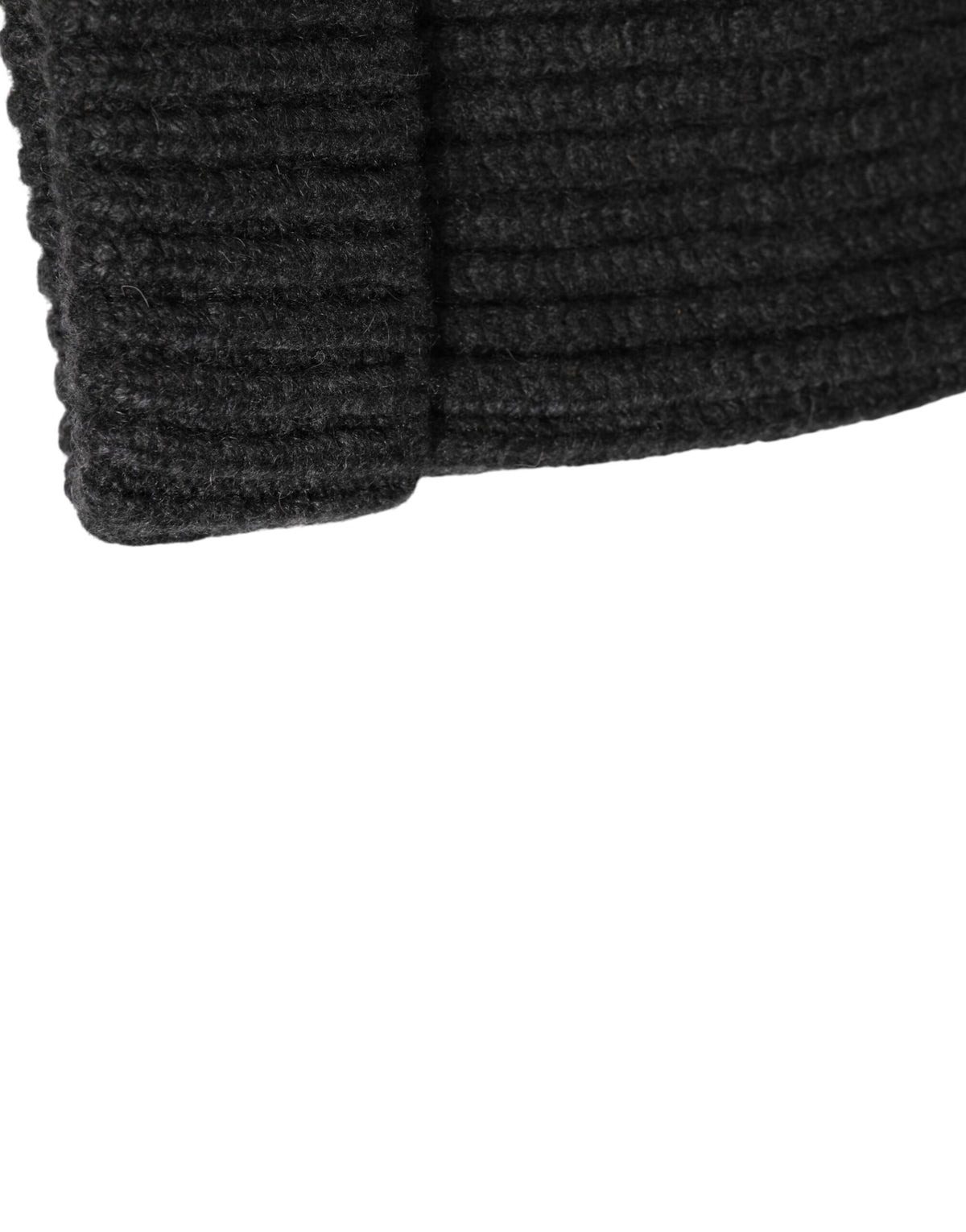 Indulge in the Dolce & Gabbana Black Cashmere Knitted Beanie, a symbol of Italian luxury and exquisite craftsmanship, perfect for elevating your seasonal style.