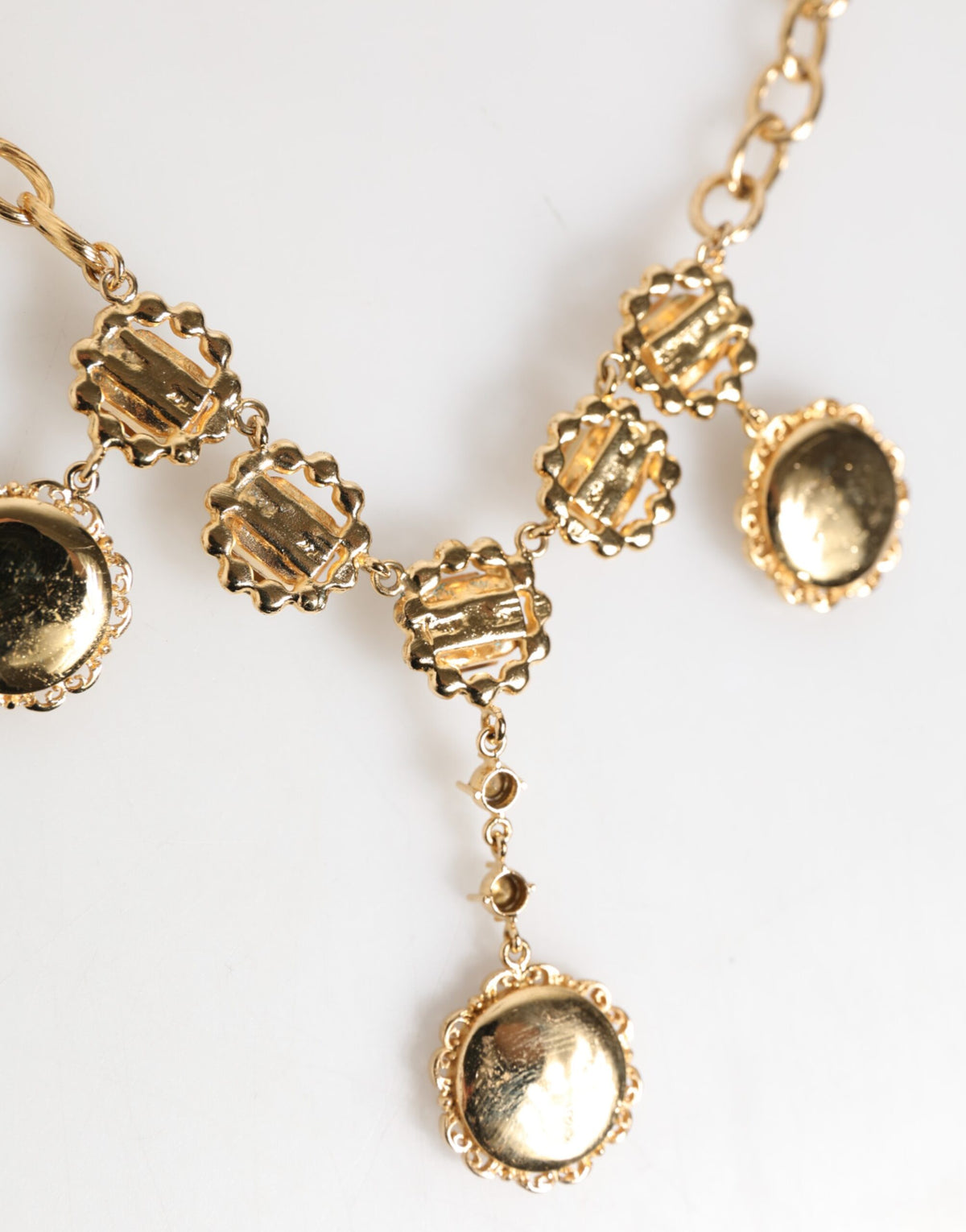Indulge in the exquisite Dolce & Gabbana Gold Crystal Clock Pendant Necklace, a luxurious blend of crystal and brass that elevates your style with timeless sophistication.