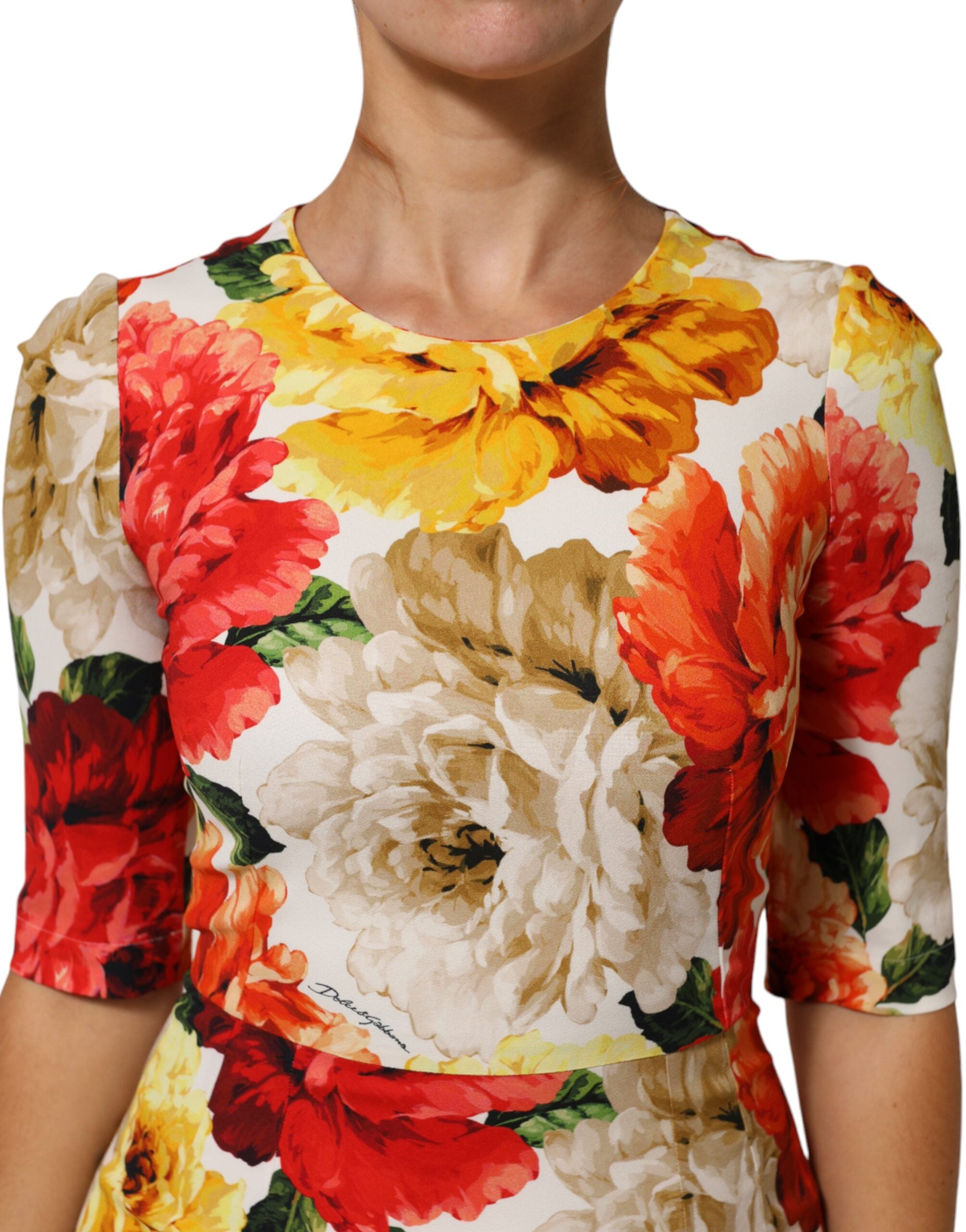 Indulge in the exquisite Dolce & Gabbana Multicolor Floral Print Viscose Sheath Dress, a masterpiece of Italian craftsmanship that embodies vibrant elegance and timeless allure.