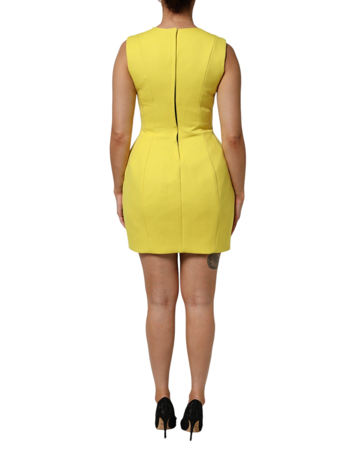 Indulge in the exquisite allure of the Dolce & Gabbana Yellow A-line Sheath Mini Dress, a luxurious blend of silk and wool, crafted in Italy for timeless elegance.