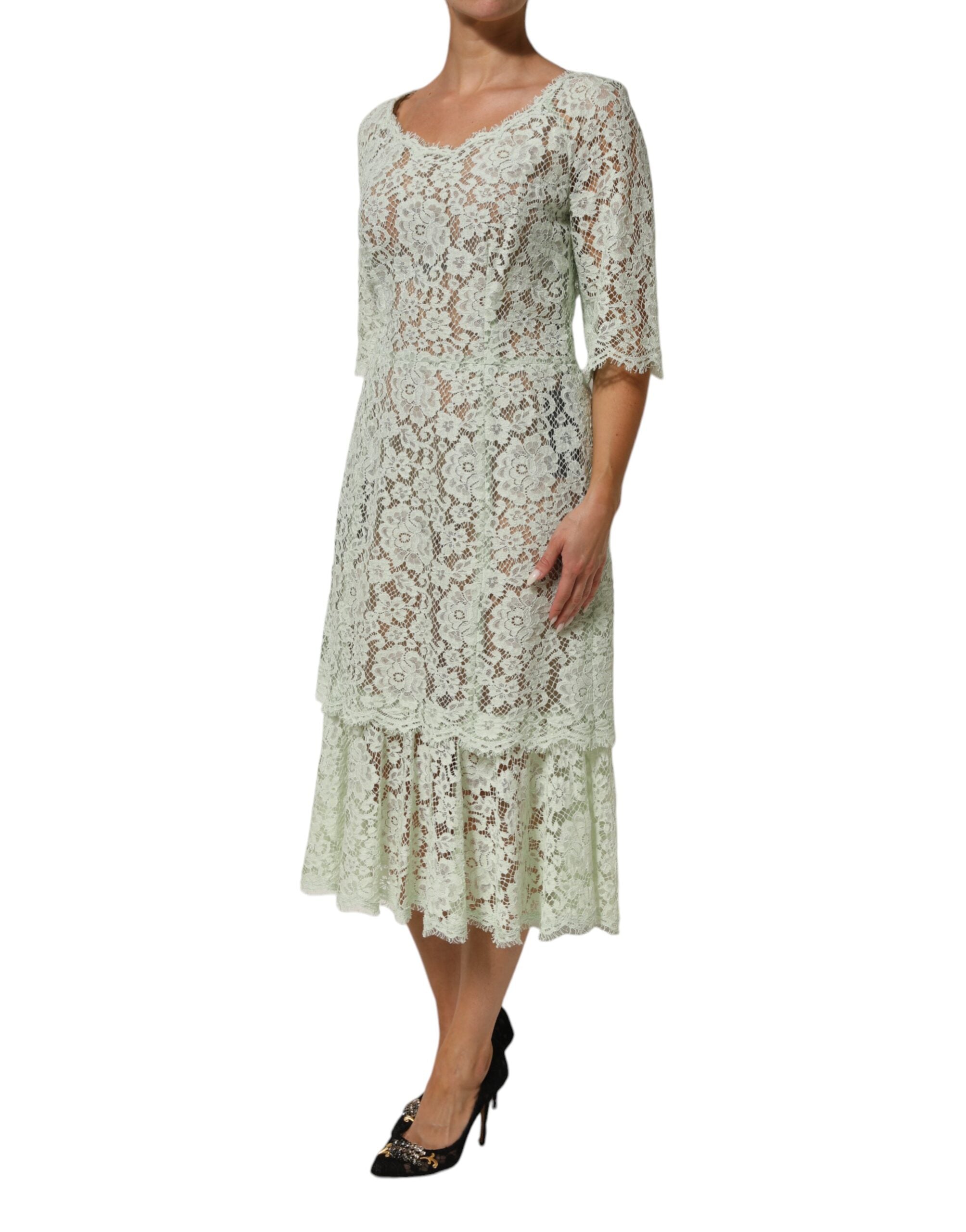 Experience the allure of the Dolce & Gabbana Mint Green Floral Lace Trim Midi Dress, crafted in Italy with luxurious materials for unforgettable elegance at any event.