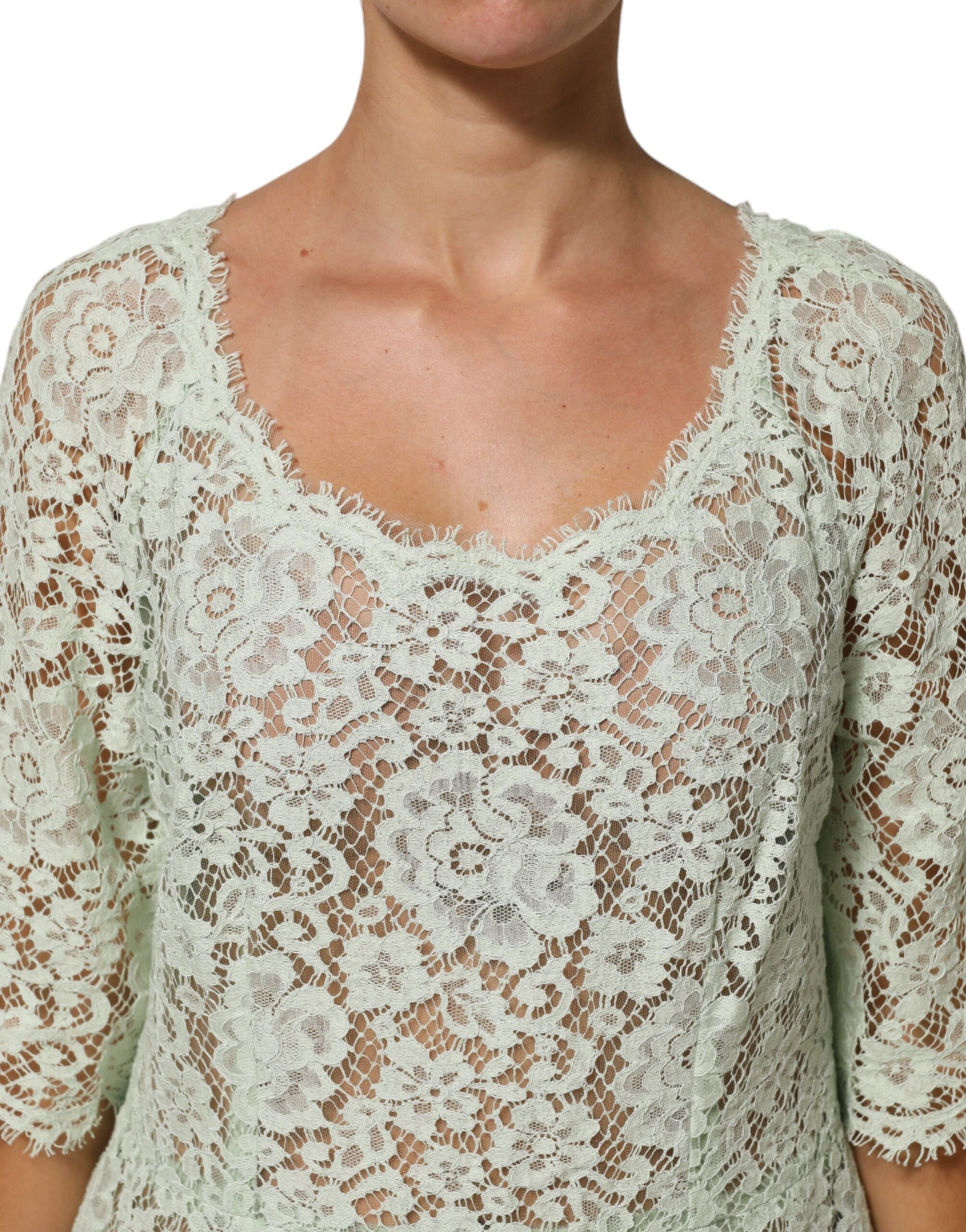 Indulge in the allure of the Dolce & Gabbana Mint Green Floral Lace Trim Midi Dress, crafted in Italy with luxurious materials for unforgettable elegance at any occasion.