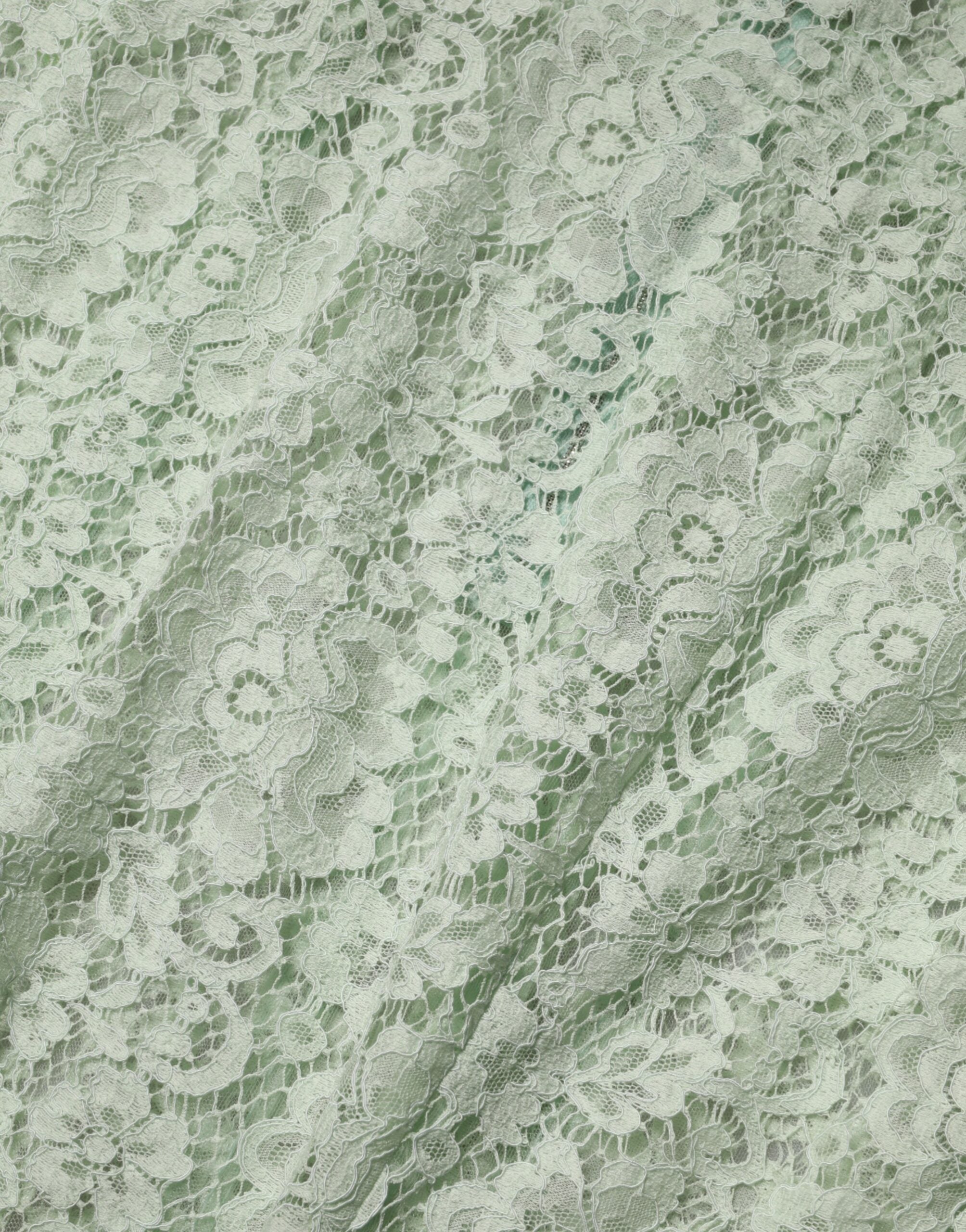 Discover the exquisite Dolce & Gabbana Mint Green Floral Lace Trim Midi Dress, a luxurious embodiment of Italian craftsmanship designed for unforgettable elegance at any occasion.