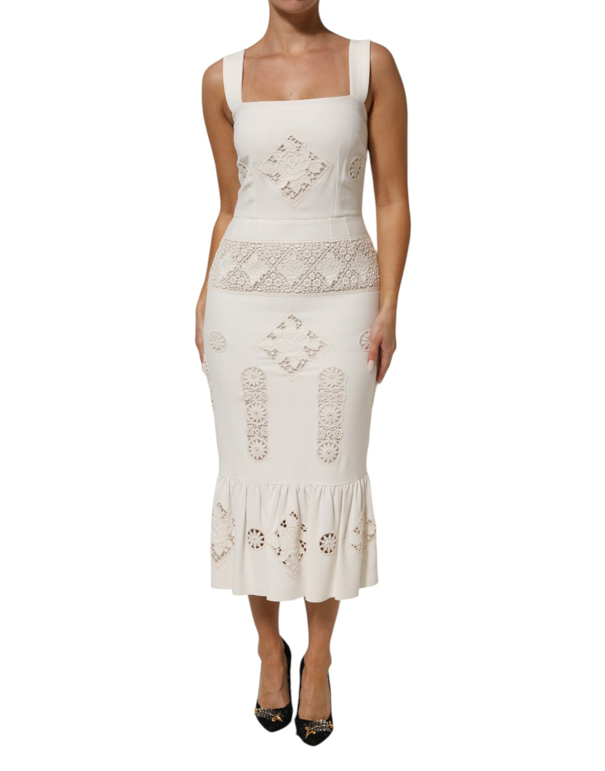 Discover the Dolce & Gabbana White Floral Lace Sleeveless Midi Dress, a timeless masterpiece of exquisite craftsmanship and luxurious materials, perfect for unforgettable moments.