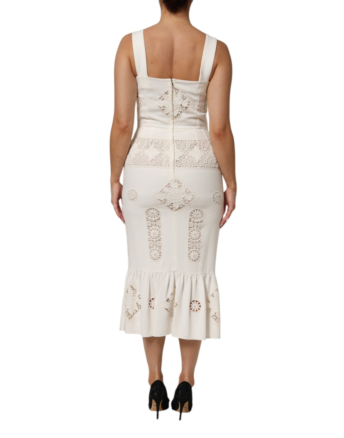 Indulge in the exquisite allure of the Dolce & Gabbana White Floral Lace Sleeveless Midi Dress, a timeless masterpiece crafted in Italy for the discerning connoisseur.