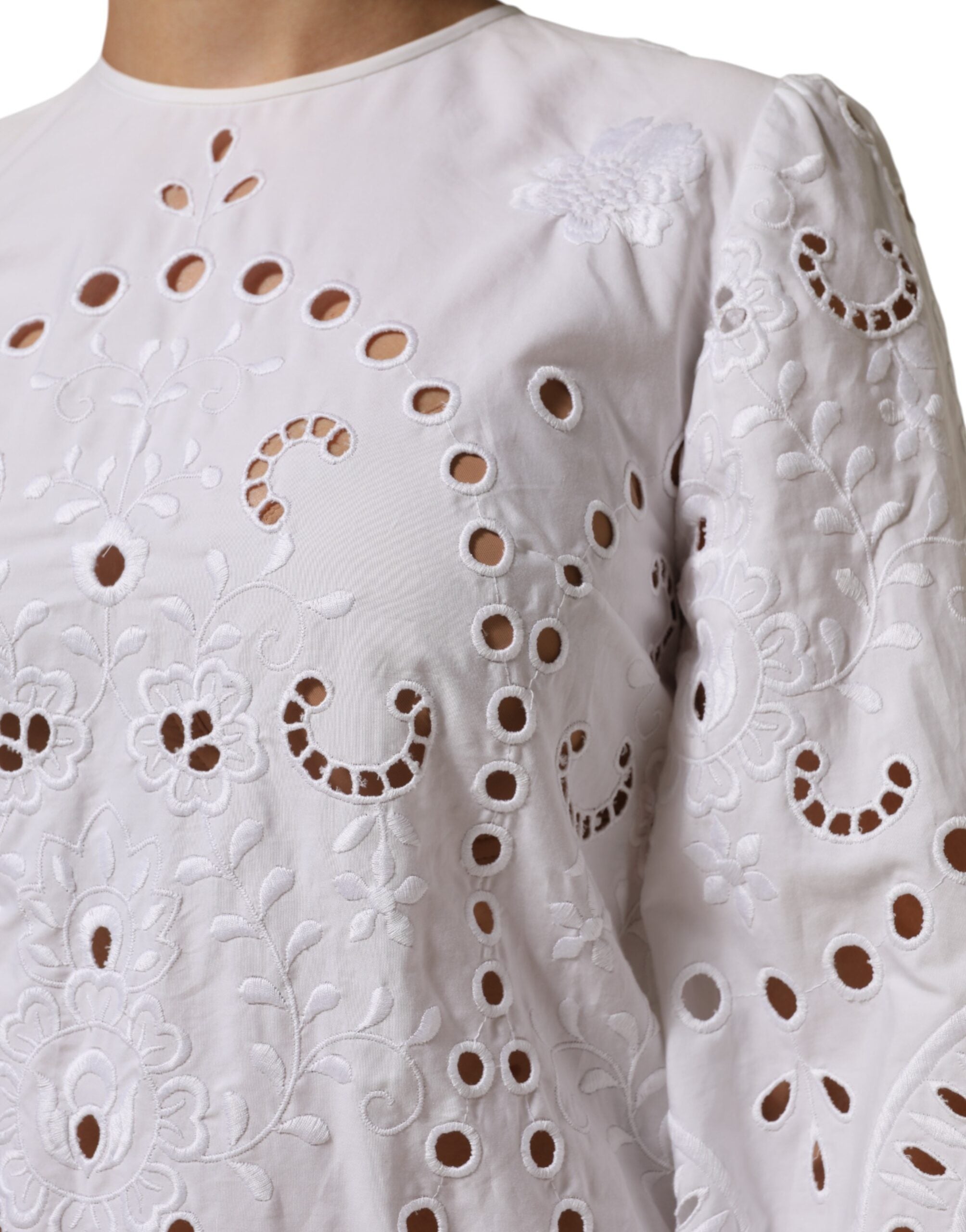Elevate your wardrobe with the Dolce & Gabbana White Cut Out A-line Sheath Mini Dress, a masterpiece of Italian craftsmanship, blending elegance and allure for the discerning individual.