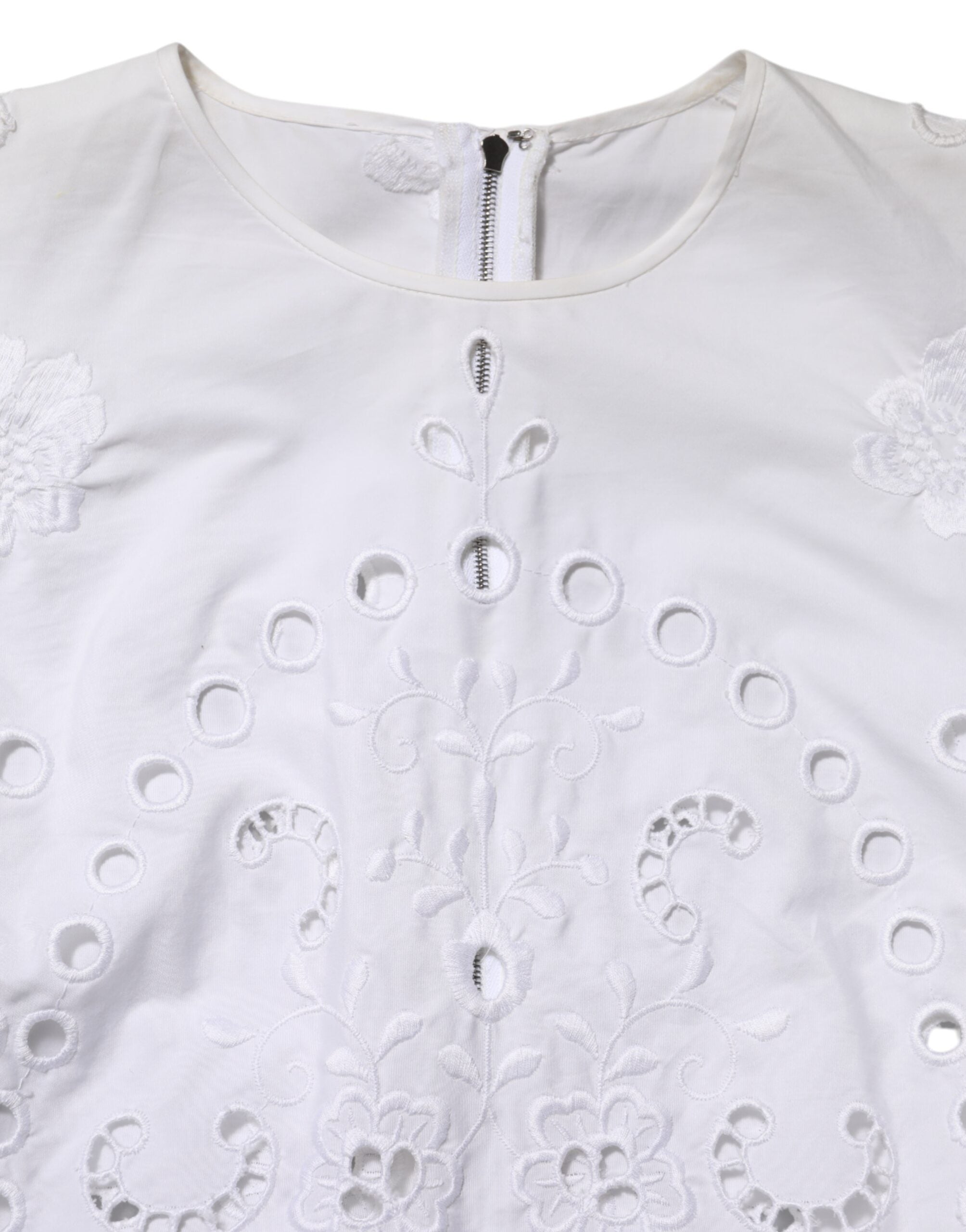 Discover the Dolce & Gabbana White Cut Out A-line Sheath Mini Dress, a luxurious blend of cotton and polyester, epitomizing Italian craftsmanship and timeless elegance.