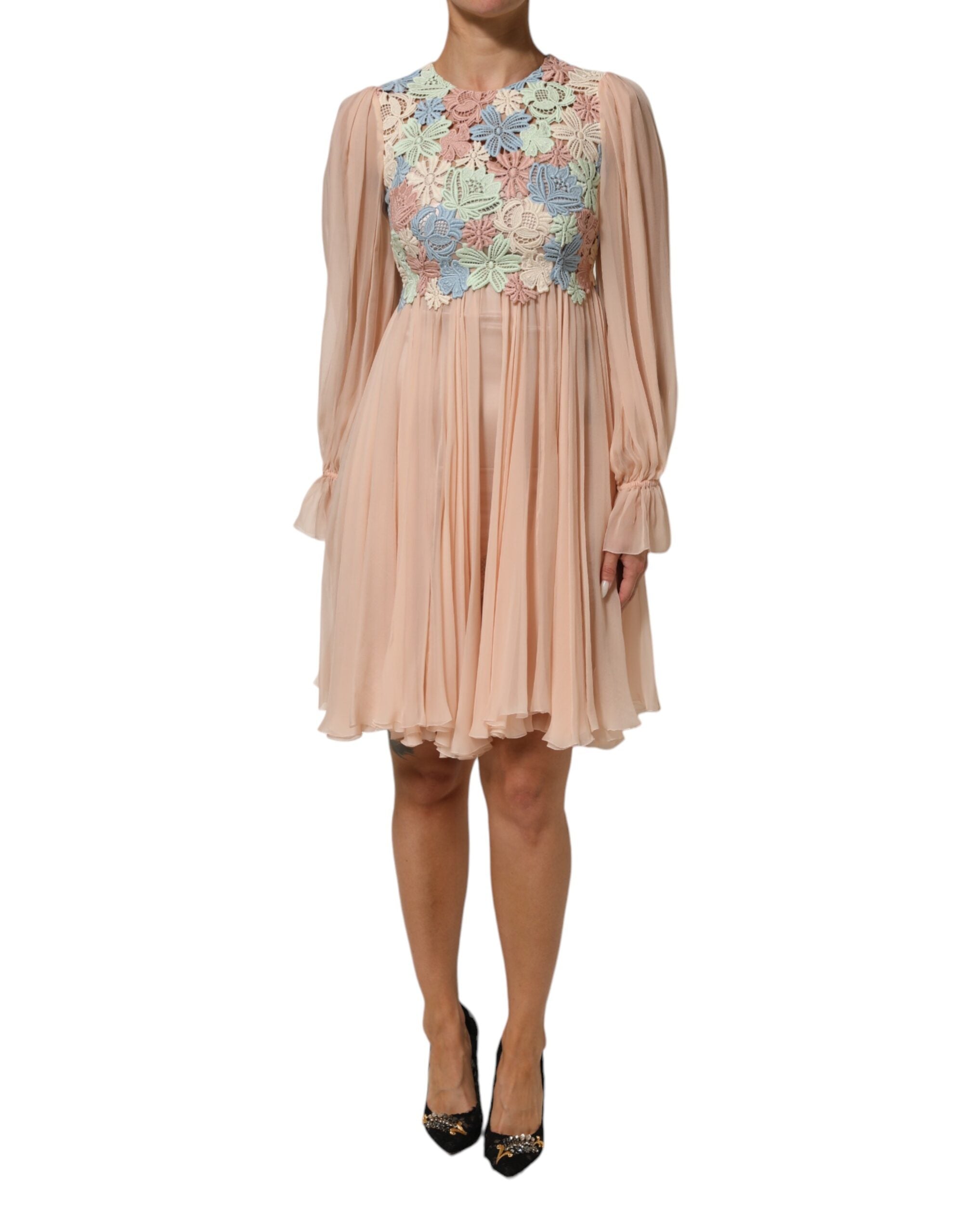 Indulge in the exquisite allure of the Dolce & Gabbana Pink Floral Embroidery Pleated A-line Dress, a masterpiece of Italian craftsmanship that embodies timeless elegance and romantic sophistication.