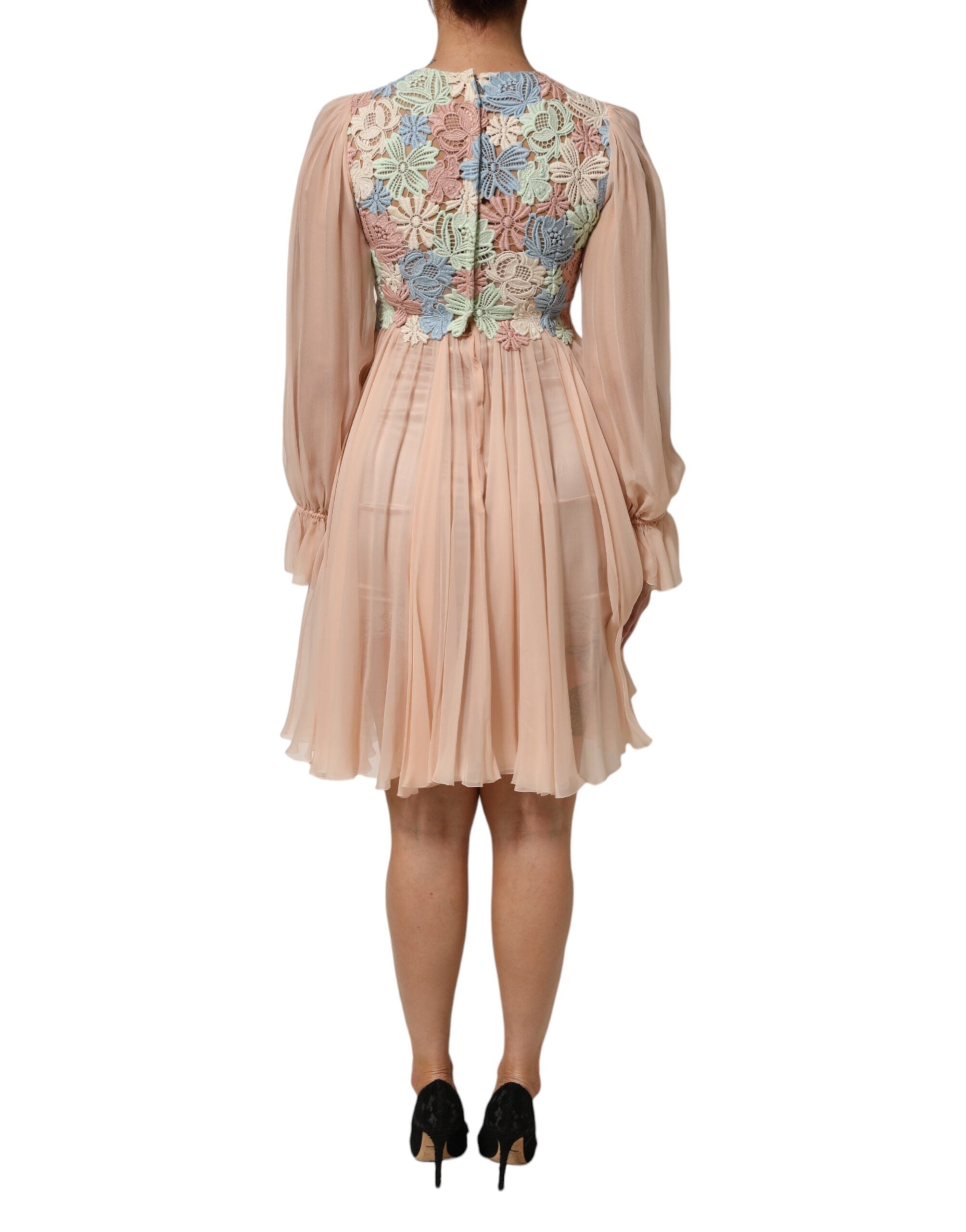Indulge in the exquisite allure of the Dolce & Gabbana Pink Floral Embroidery Pleated A-line Dress, a masterpiece of Italian craftsmanship that embodies timeless elegance and sensuality.