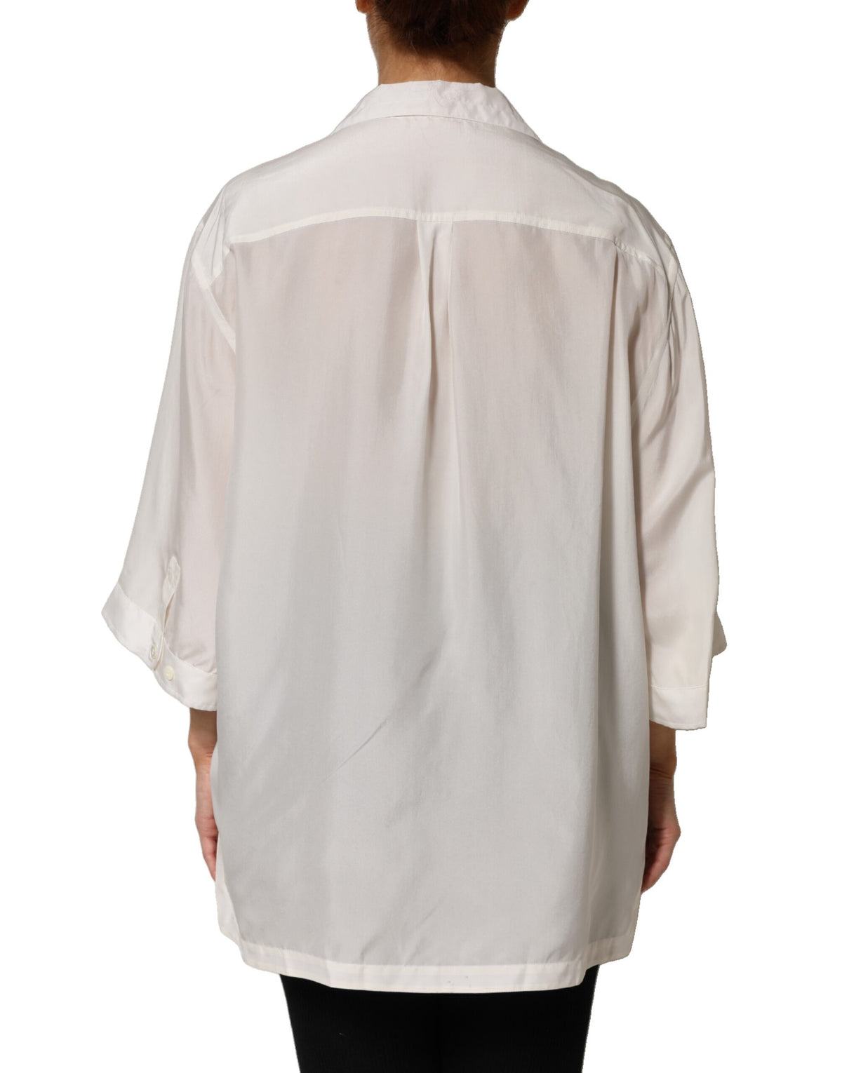 Indulge in the exquisite Dolce & Gabbana Off White Silk Button Down Polo Shirt, a timeless piece of Italian craftsmanship that elevates your sophisticated style for any occasion.