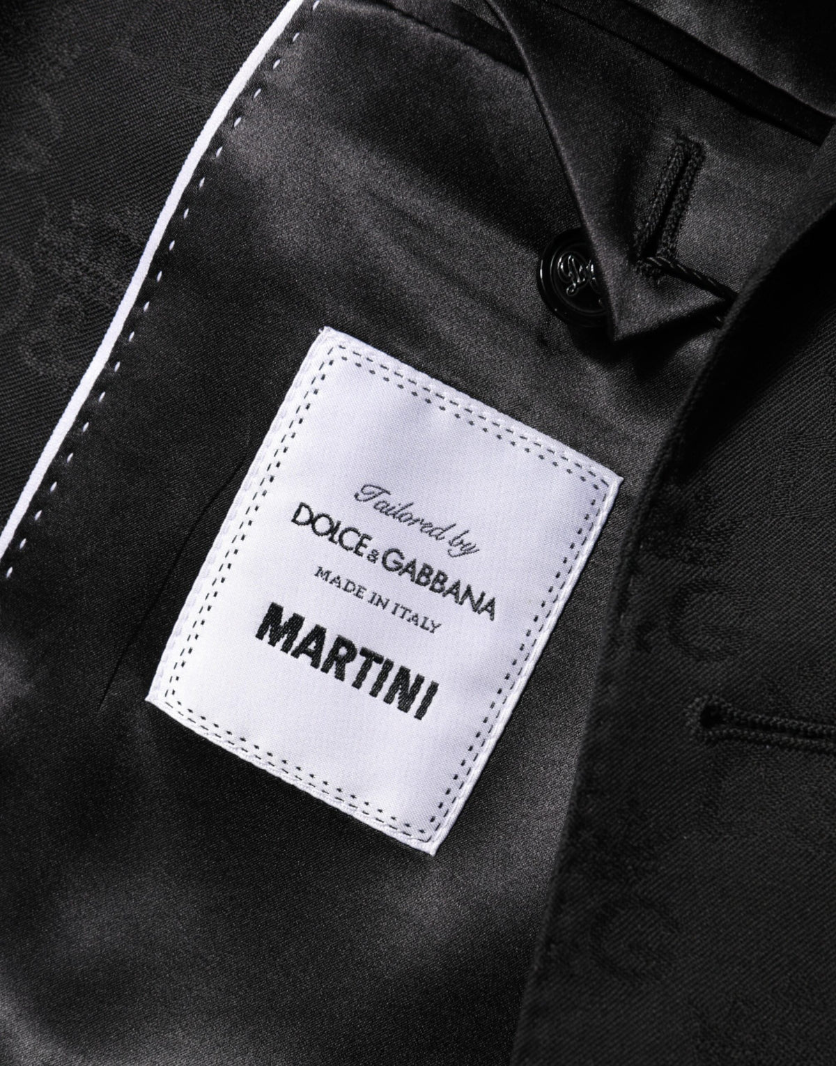 Elevate your wardrobe with the Dolce & Gabbana Black MARTINI Suit Jacket Blazer, crafted from luxurious virgin wool and silk, embodying timeless elegance and exquisite Italian craftsmanship.