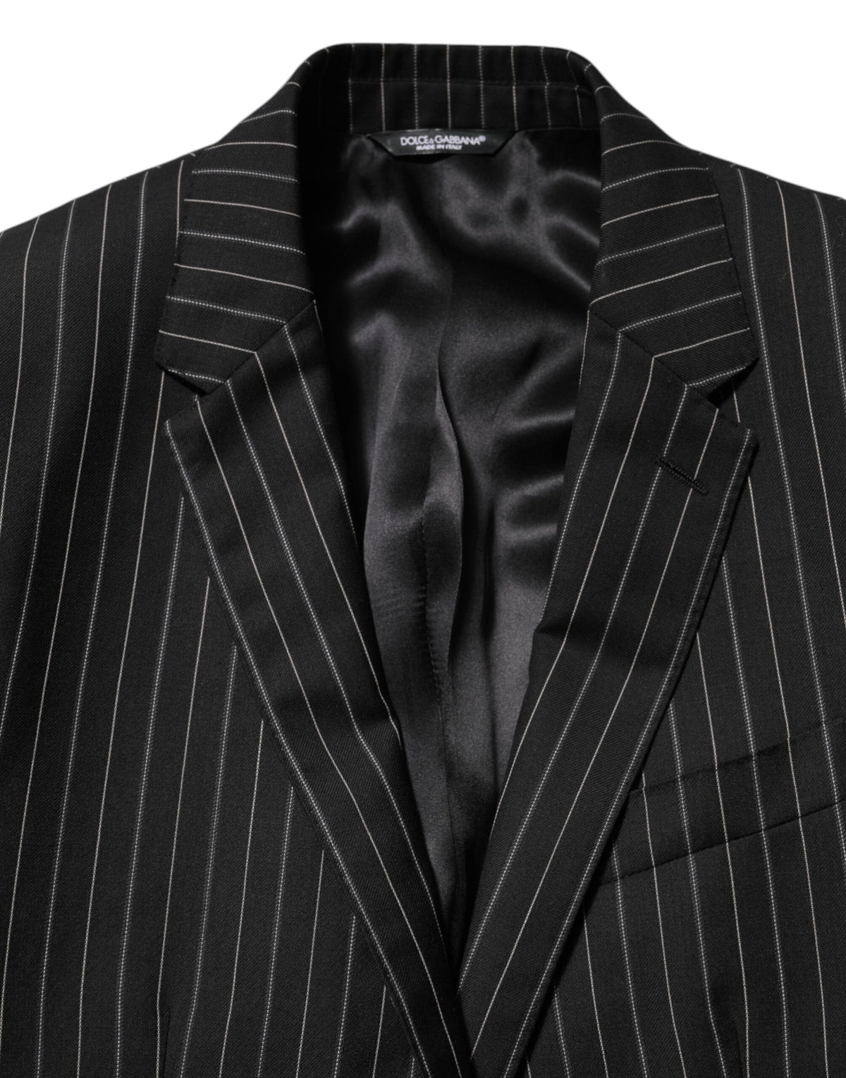 Elevate your wardrobe with the Dolce & Gabbana Black Stripes MARTINI Blazer, a masterpiece of Italian craftsmanship that embodies timeless elegance and refined luxury.