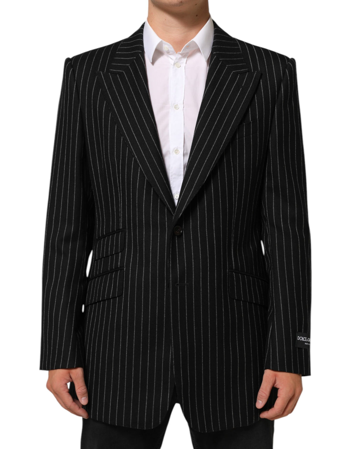 Indulge in the exquisite Dolce & Gabbana Black Stripes 2 Buttons Suit Jacket, a masterpiece of Italian craftsmanship that embodies timeless elegance and sophisticated allure.