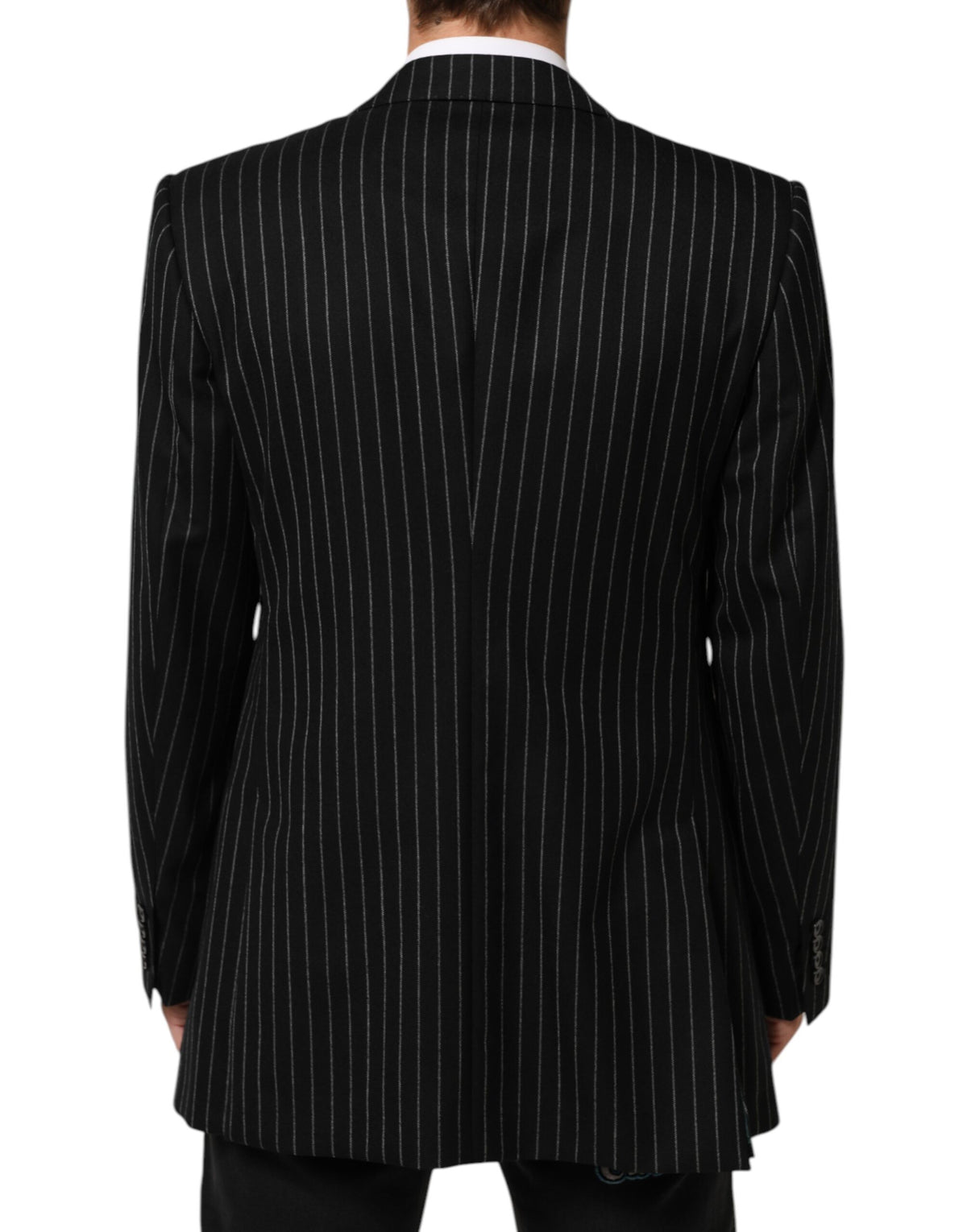 Elevate your wardrobe with the Dolce & Gabbana Black Stripes Suit Jacket, a masterpiece of Italian craftsmanship that embodies timeless elegance and sophisticated allure.