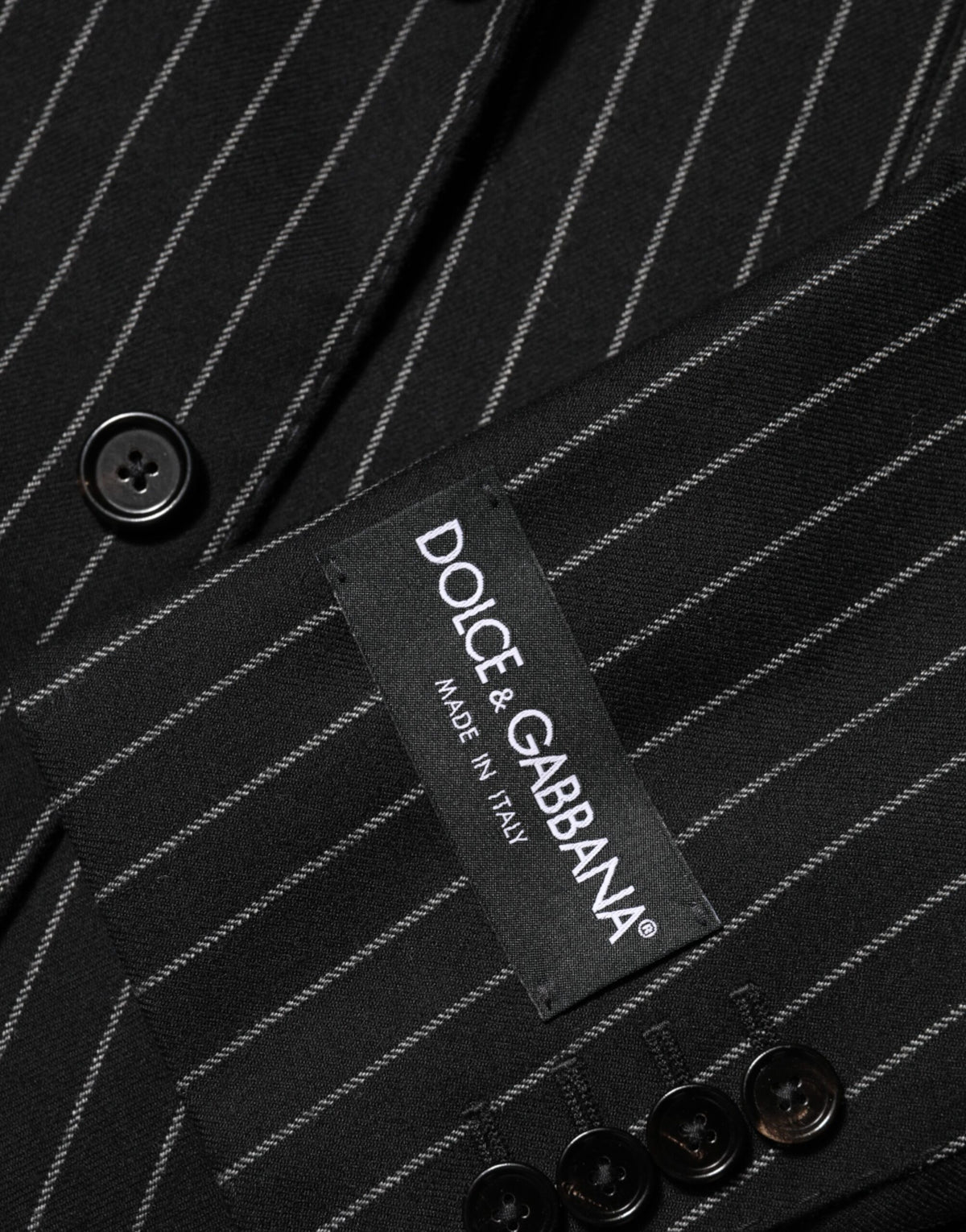 Elevate your wardrobe with the Dolce & Gabbana Black Stripes Suit Jacket, a masterpiece of Italian craftsmanship that embodies timeless elegance and refined allure.