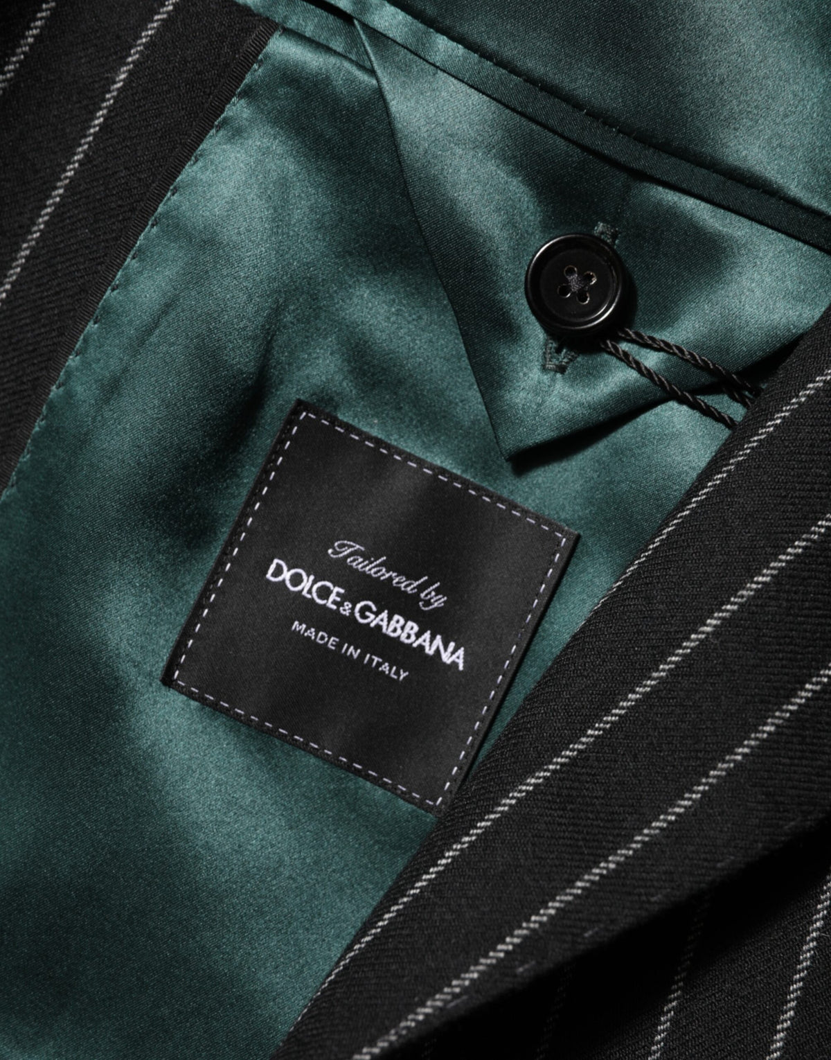 Elevate your wardrobe with the Dolce & Gabbana Black Stripes 2 Buttons Suit Jacket Blazer, a masterpiece of Italian craftsmanship that exudes timeless elegance and sophistication.