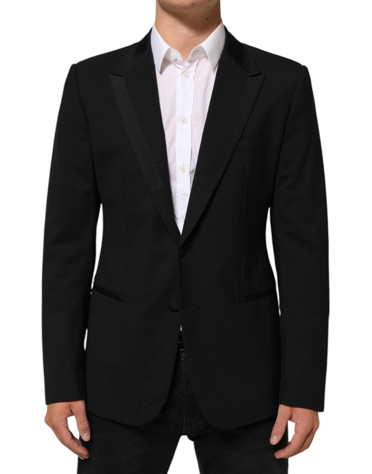 Experience the allure of Dolce & Gabbana's Black Wool Blazer, a masterpiece of Italian craftsmanship, blending luxurious materials with timeless elegance for the discerning individual.