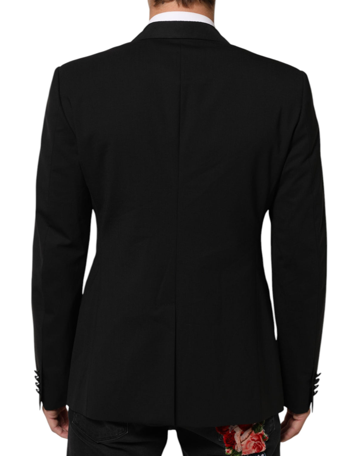 Discover the Dolce & Gabbana Black Wool Blazer, a masterpiece of Italian craftsmanship blending luxury and sophistication, perfect for the discerning individual.