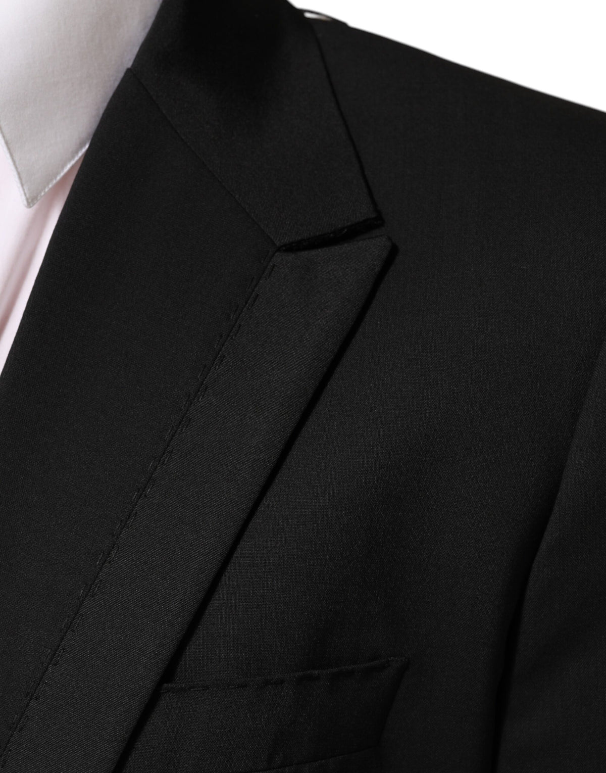 Discover the exquisite Dolce & Gabbana Black Wool Blazer, a masterpiece of Italian craftsmanship, blending luxurious materials for the discerning individual.