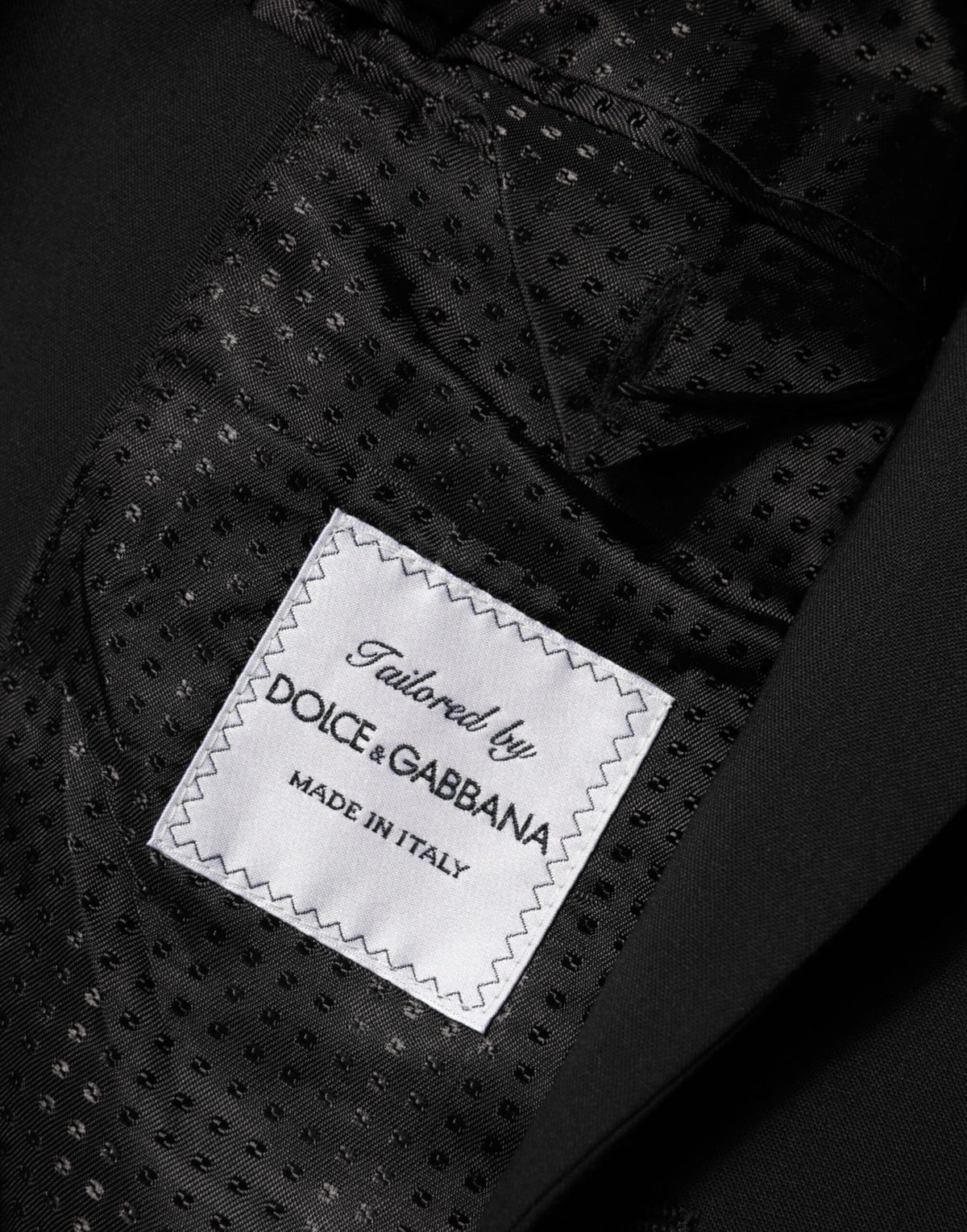 Experience the allure of Dolce & Gabbana's Black Wool Blazer, crafted from luxurious materials for the discerning individual, embodying timeless elegance and sophistication.