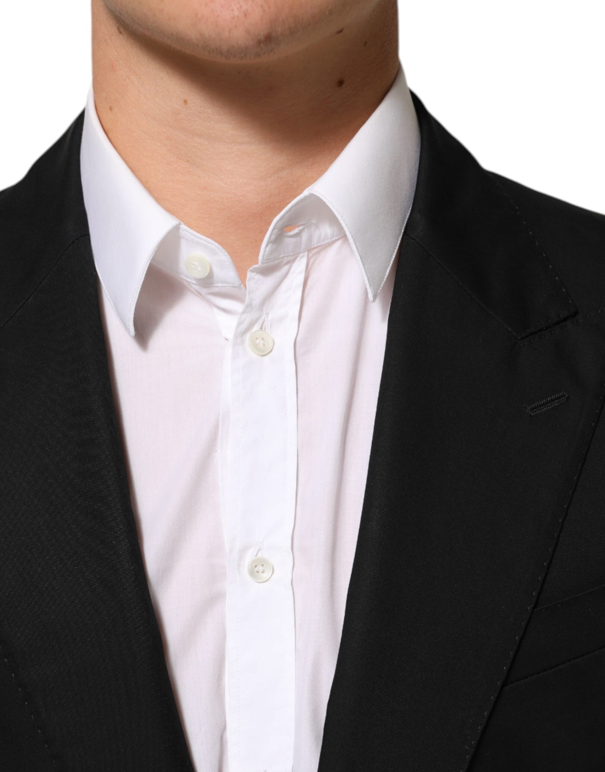 Elevate your wardrobe with the Dolce & Gabbana Black Wool 2 Buttons Suit Men Jacket Blazer, a masterpiece of Italian craftsmanship that embodies timeless elegance and sophistication.