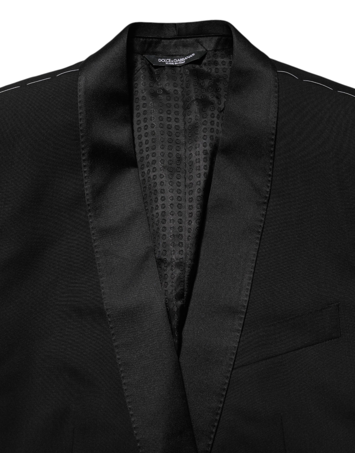 Discover the Dolce & Gabbana Black MARTINI 1 Button Suit Jacket Blazer, a masterpiece of Italian craftsmanship, blending luxurious materials with timeless elegance for the discerning individual.