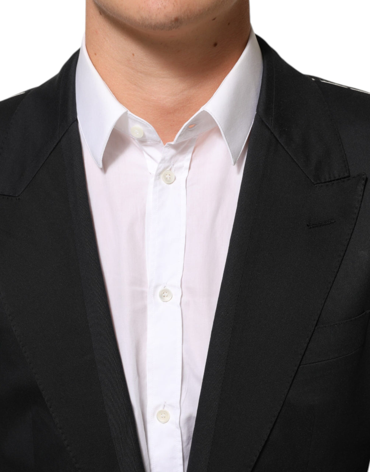 Experience the allure of Dolce & Gabbana's Black Cotton 2 Buttons Suit Jacket Blazer, a masterpiece of Italian craftsmanship that epitomizes timeless elegance and sophistication.