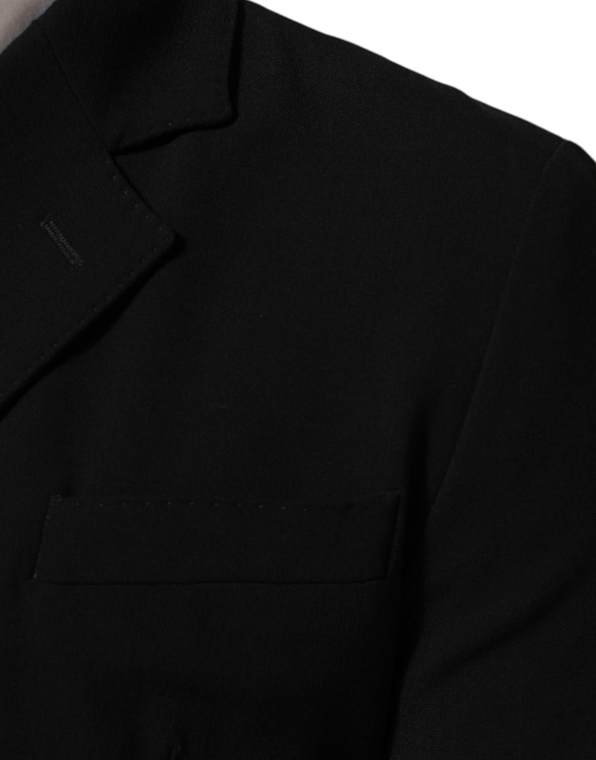 Indulge in the exquisite Dolce & Gabbana Black Wool Double Breasted Blazer, a masterpiece of Italian craftsmanship that elevates your elegance and confidence.