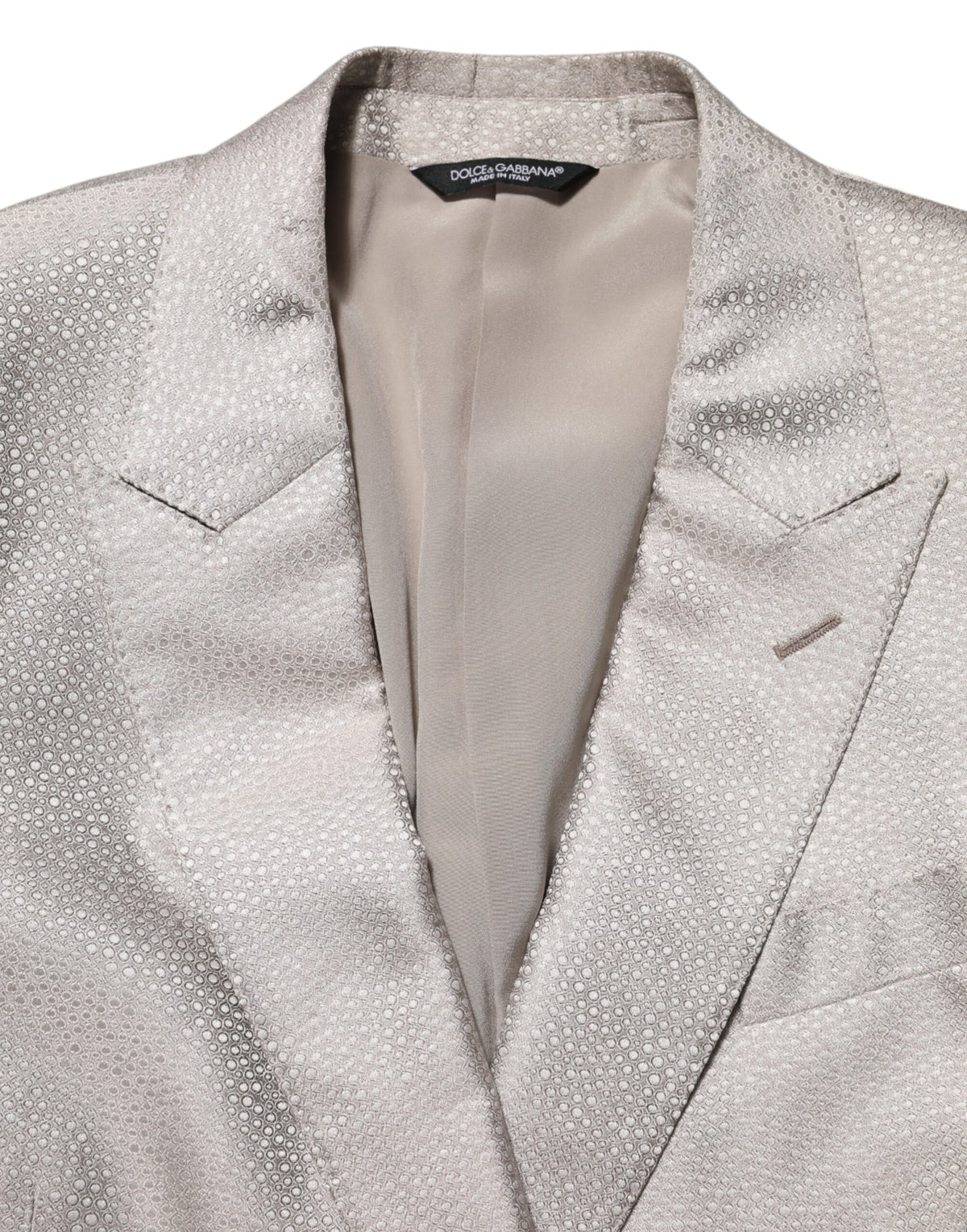 Elevate your elegance with the Dolce & Gabbana Beige MARTINI Double-Breasted Suit Blazer, a masterpiece of silk craftsmanship that embodies timeless sophistication and allure.