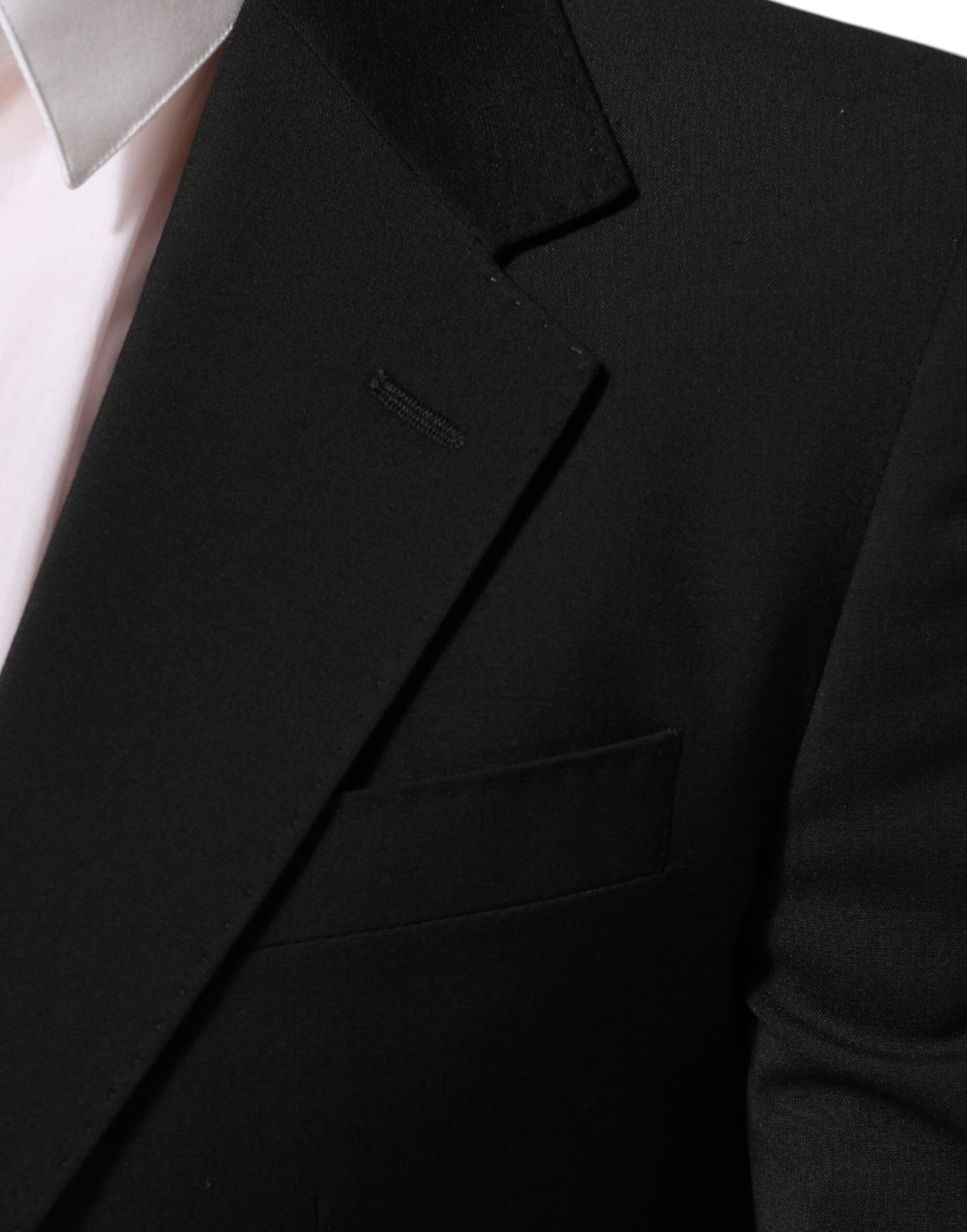 Elevate your wardrobe with the Dolce & Gabbana Black STAFF Blazer, a masterpiece of Italian craftsmanship that embodies timeless elegance and refined sophistication.
