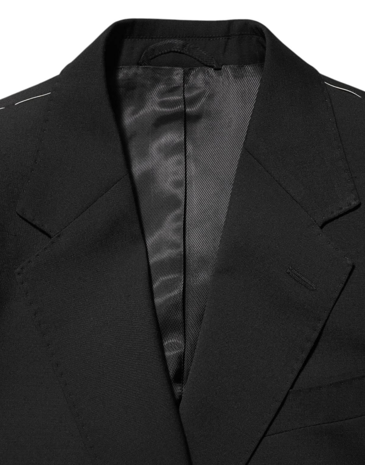 Discover the Dolce & Gabbana Black STAFF Blazer, a masterpiece of Italian craftsmanship, blending luxurious materials for an exquisite fit that defines elegance and sophistication.