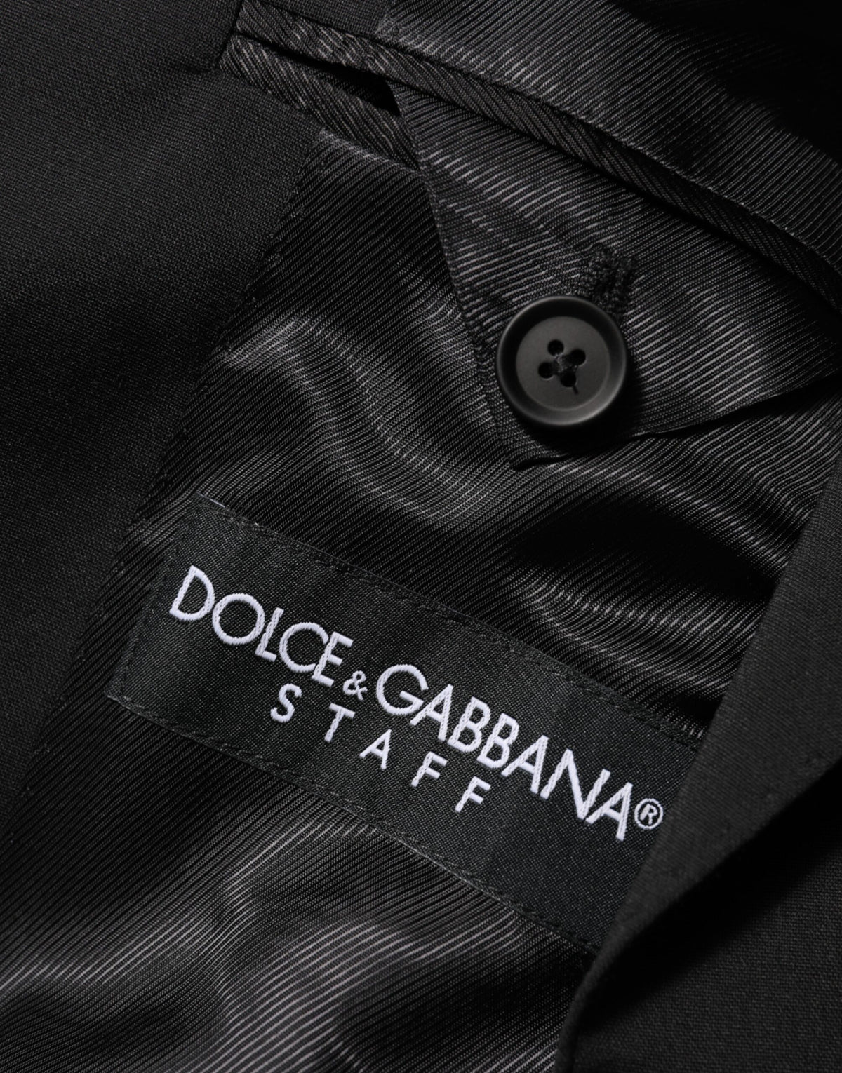 Experience the allure of the Dolce & Gabbana Black STAFF Blazer, a masterpiece of Italian craftsmanship that embodies timeless elegance and sophisticated style.